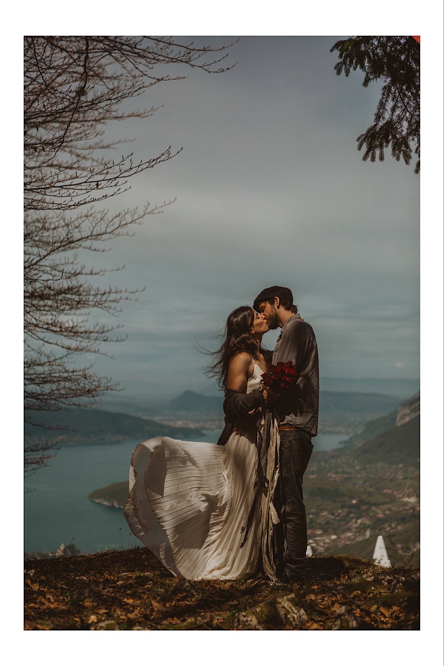 08_TWS-135_couple_annecy_elope_french_lake_alps_photography_wind_intimate_kiss_elopment_wedding.jpg