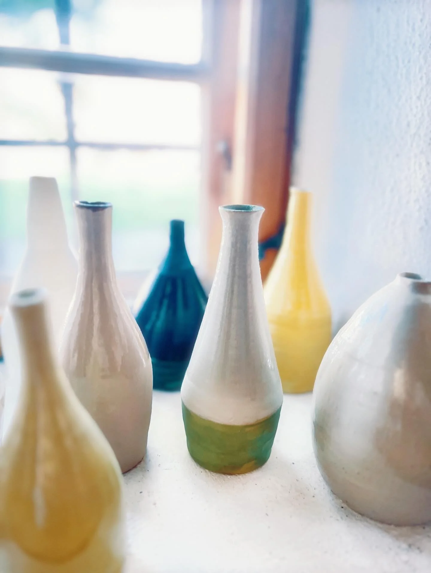 I had such joy creating this collection of stoneware ceramic bottles. Each one has its own personality, glaze and color combination.  I had no idea if they'd work as a group but they flow together to make a statement.

I've always been deeply inspire