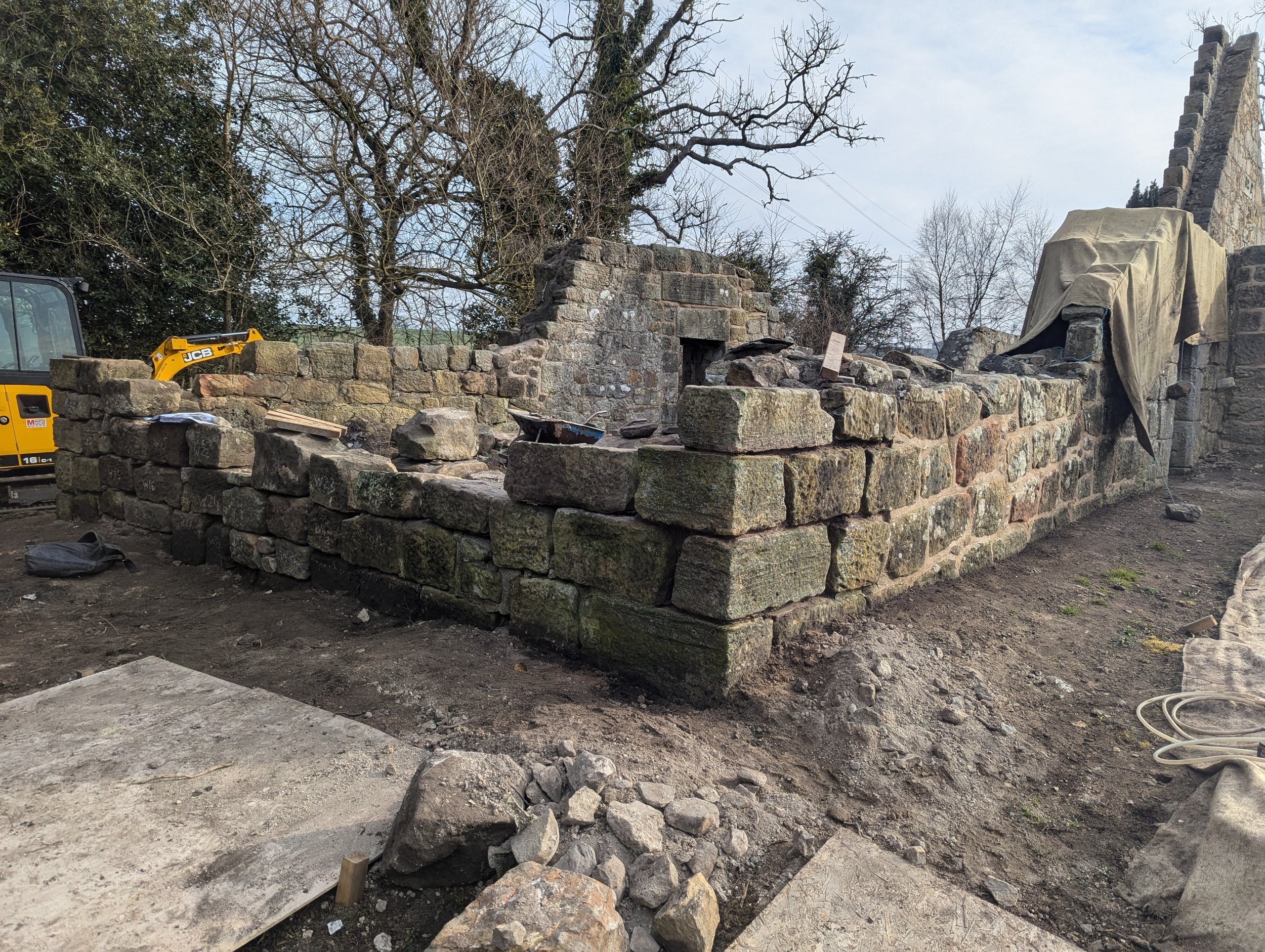 Rebuilding collapsed wall at West Kirk, Culross