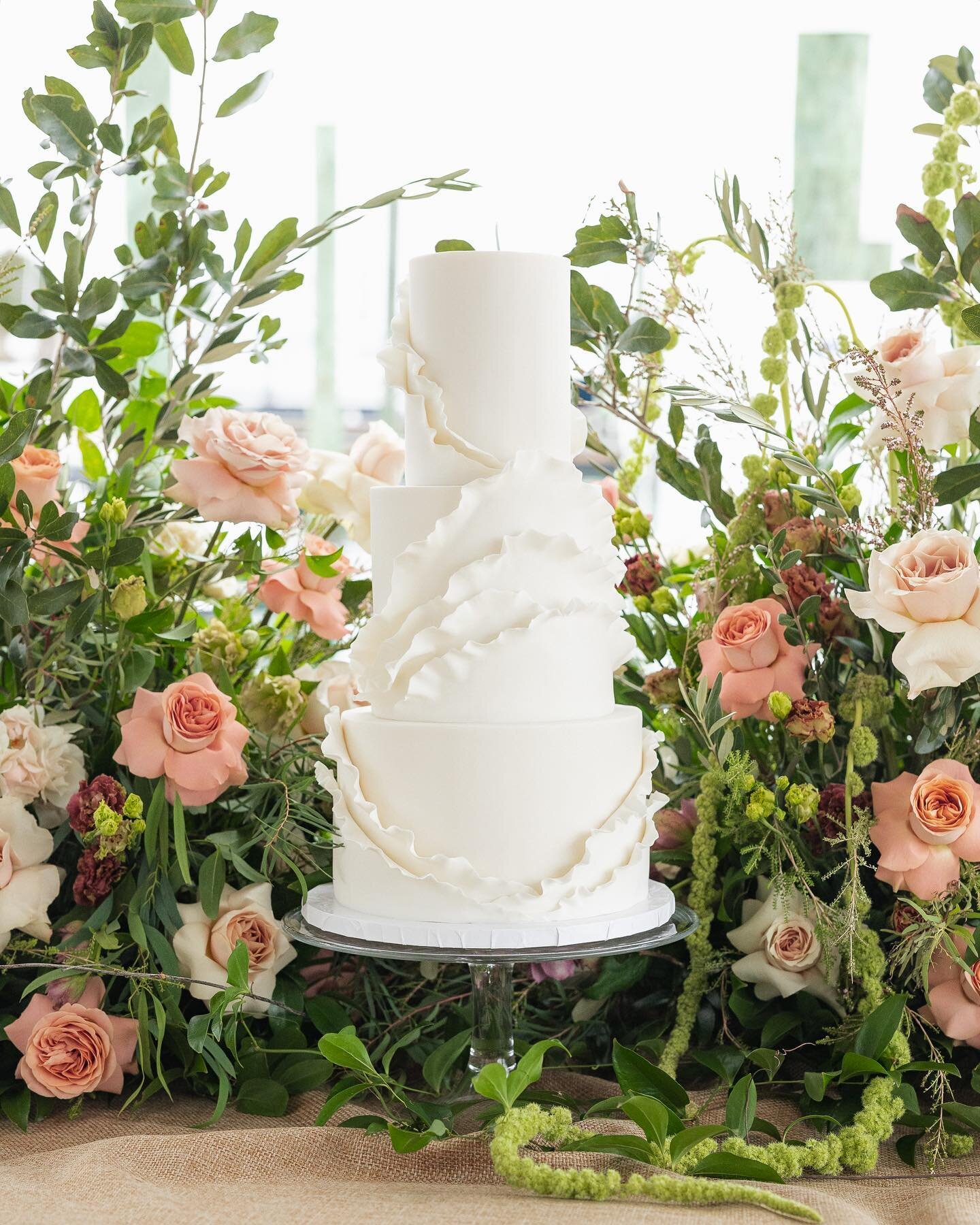 We wanted to create a design that embodies a seamless fusion of classic and modern elements, resulting in a cake that transcends traditional boundaries. 

Fondant waves gracefully cascading down the sides of the cake, creating a sense of movement and