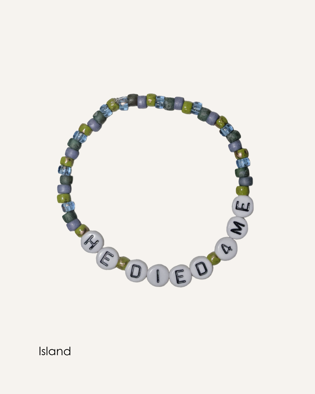Island colorway HE DIED 4ME Christian bracelet featuring blue and green seed beads with white alphabet beads on stretch band.