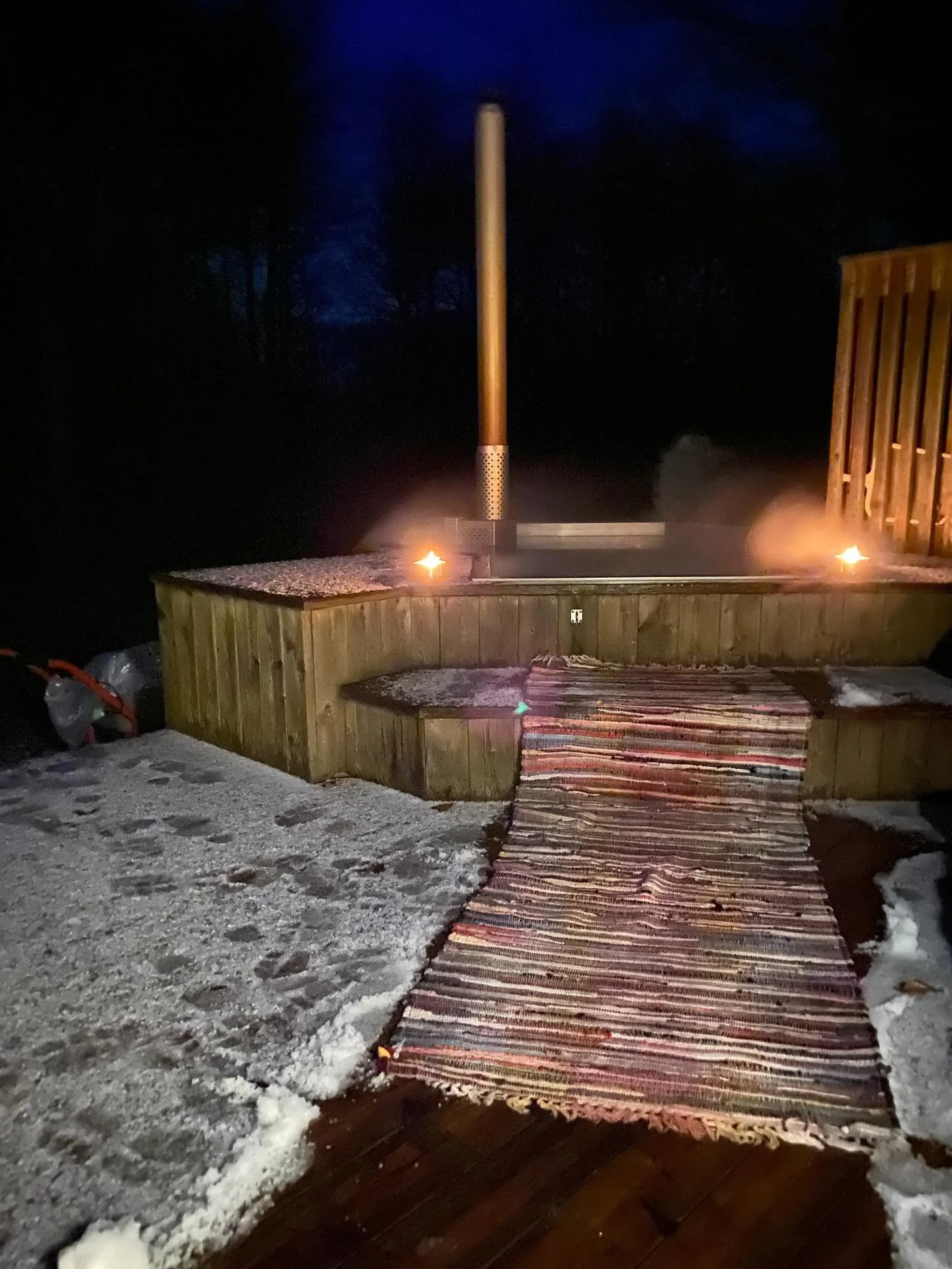 Celebrating our first snowfall with a dip in the hot tub 🔥