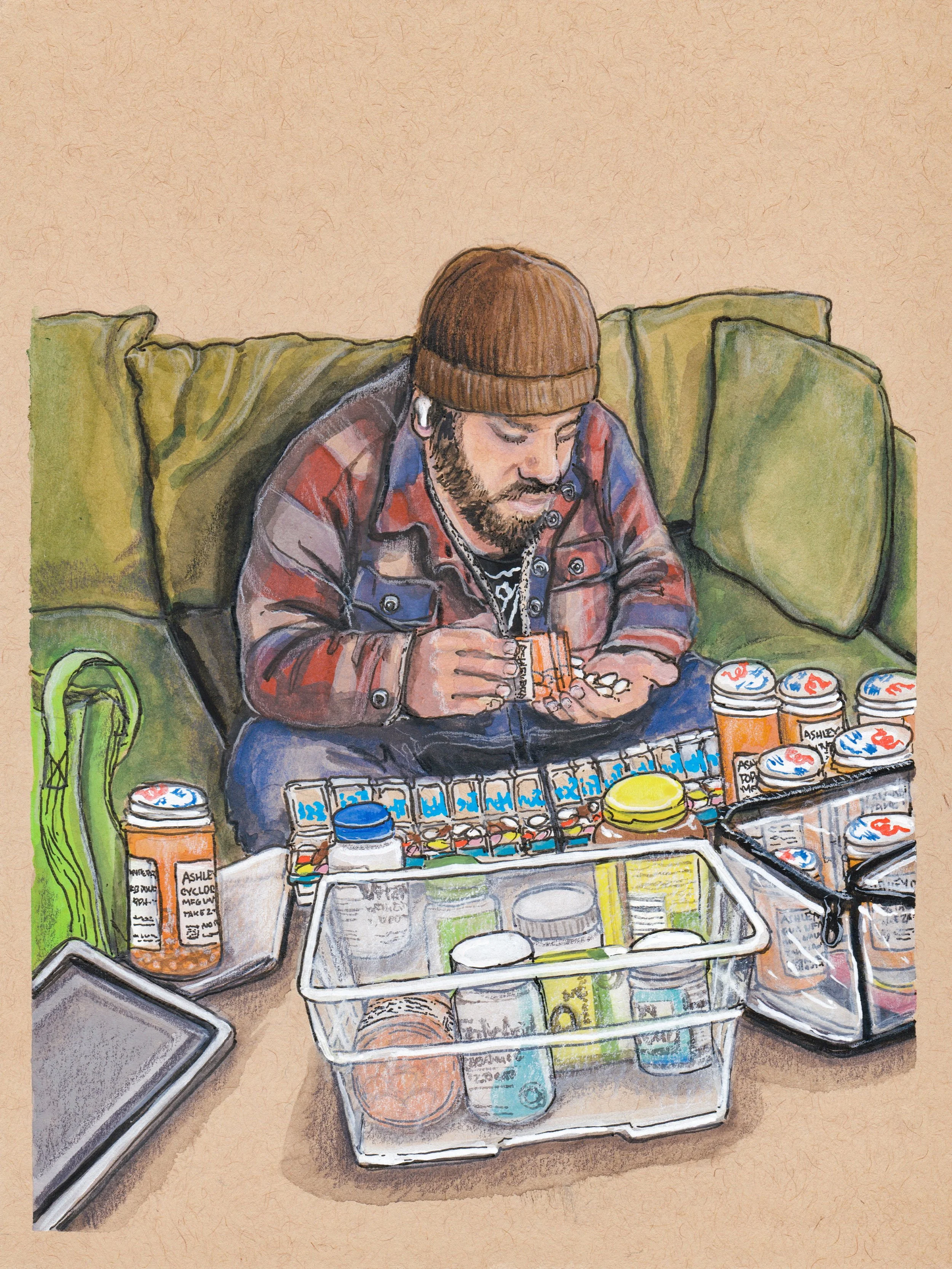 A gouache and ink painting on toned paper  of Ashley's partner seated on a green couch wearing a plaid jacket, jeans, and a brown beanie, hunched over a table full of pills and supplements, filling pill cases with colorful medications.