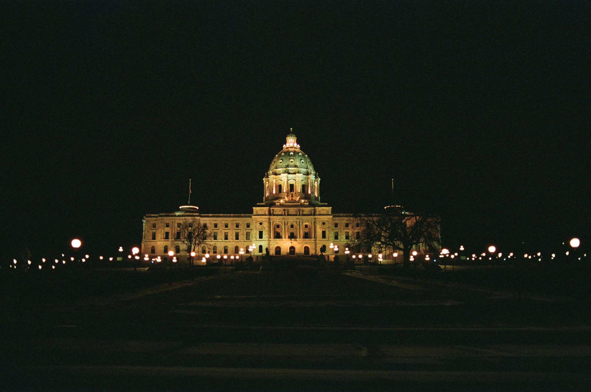Minnesota State Capitol building at night where AI nudification technology ban was passed