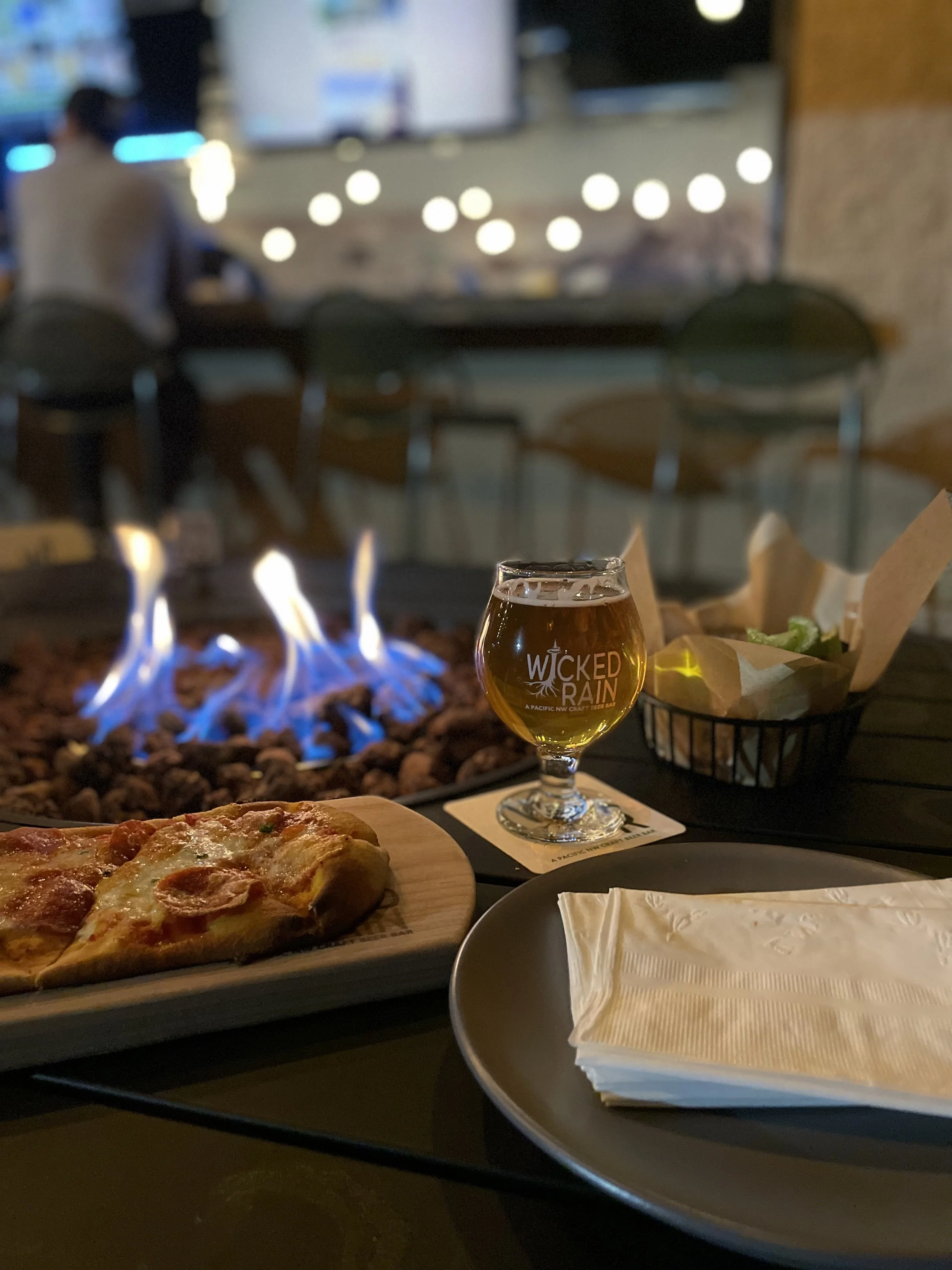 Corner lounge with firepit at Wicked Rain