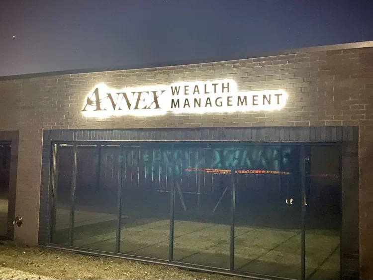 Annex wealth exterior illuminated close.webp