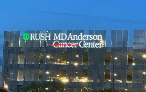 RUSH MD cancer center exterior illuminated.webp