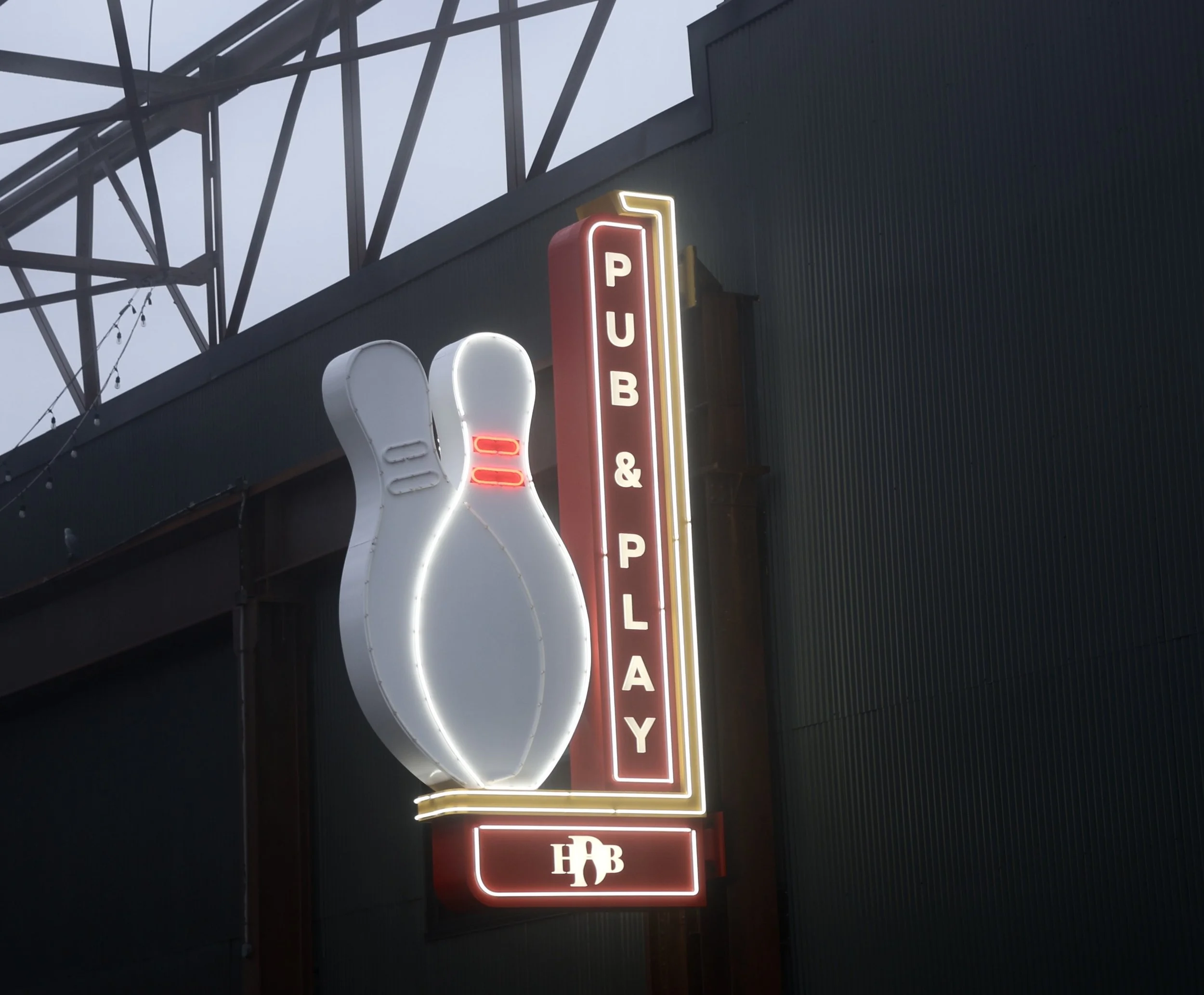Henry Ds exterior wayfinding blade illuminated.jpeg