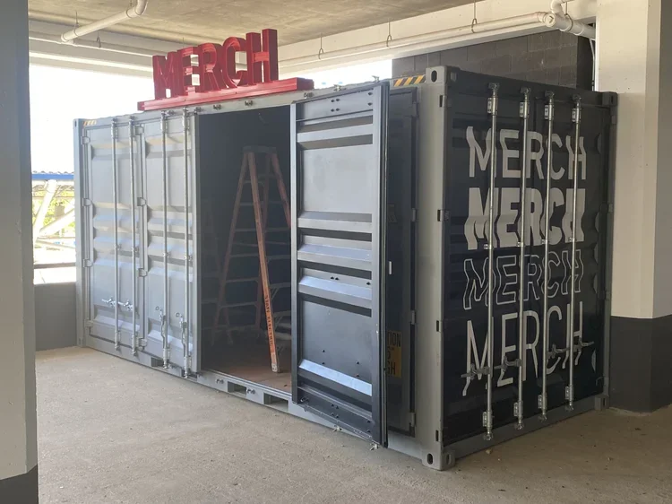 Summerfest merch exterior illuminated.webp