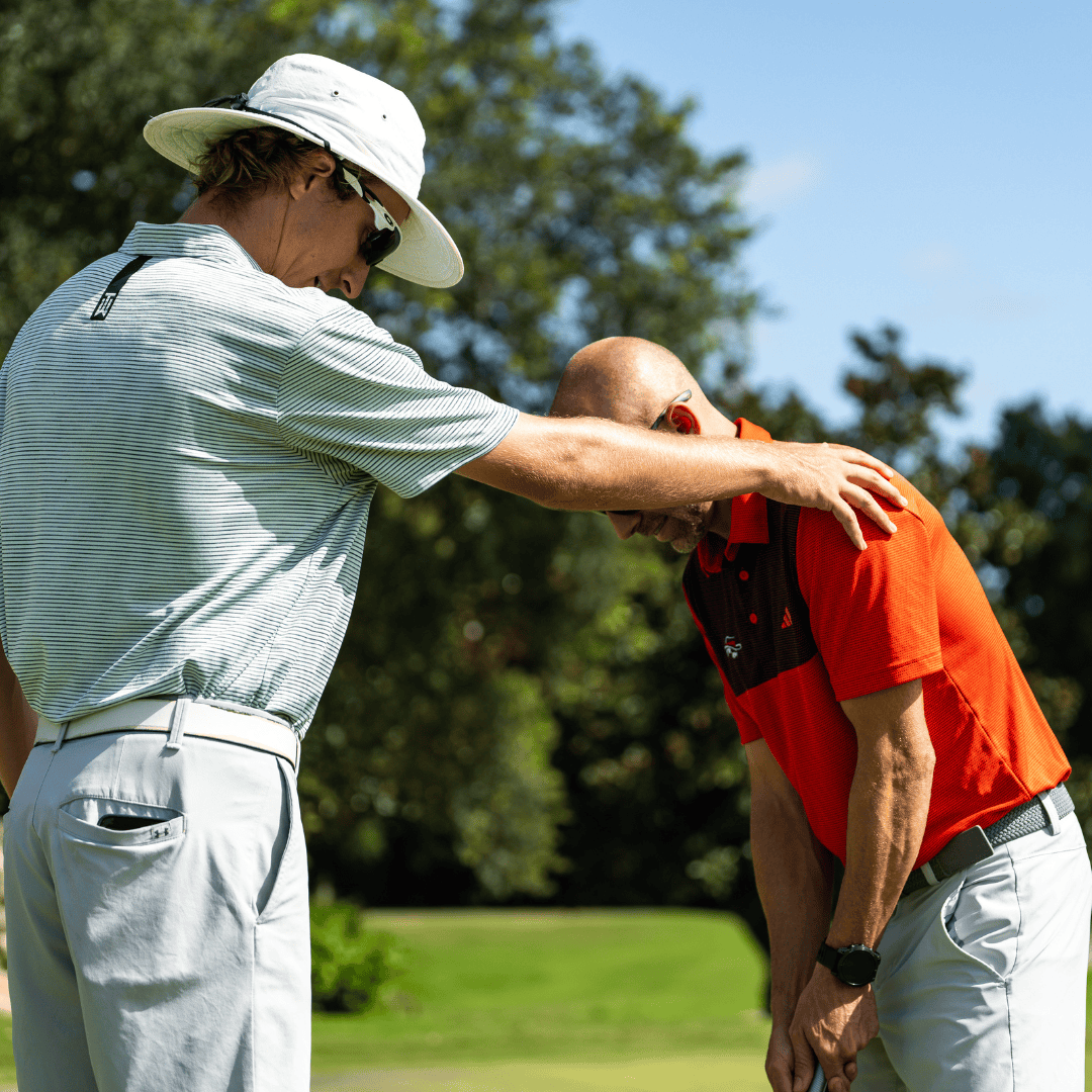 Ben Clarke teaching a client putting
