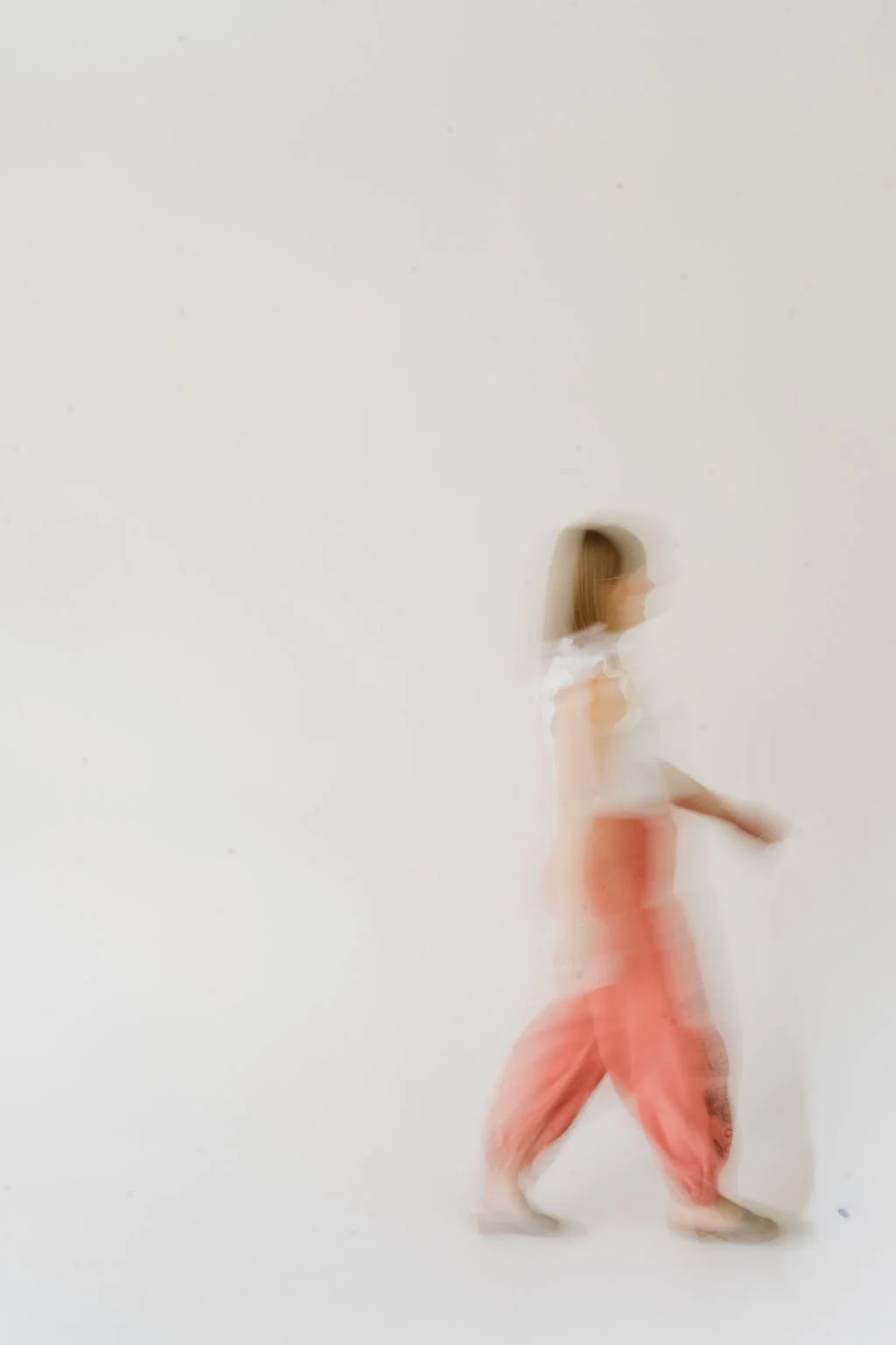 Leanne Morton, LPC, ATR, therapist for women and moms in Denver, Colorado, walking across the screen.