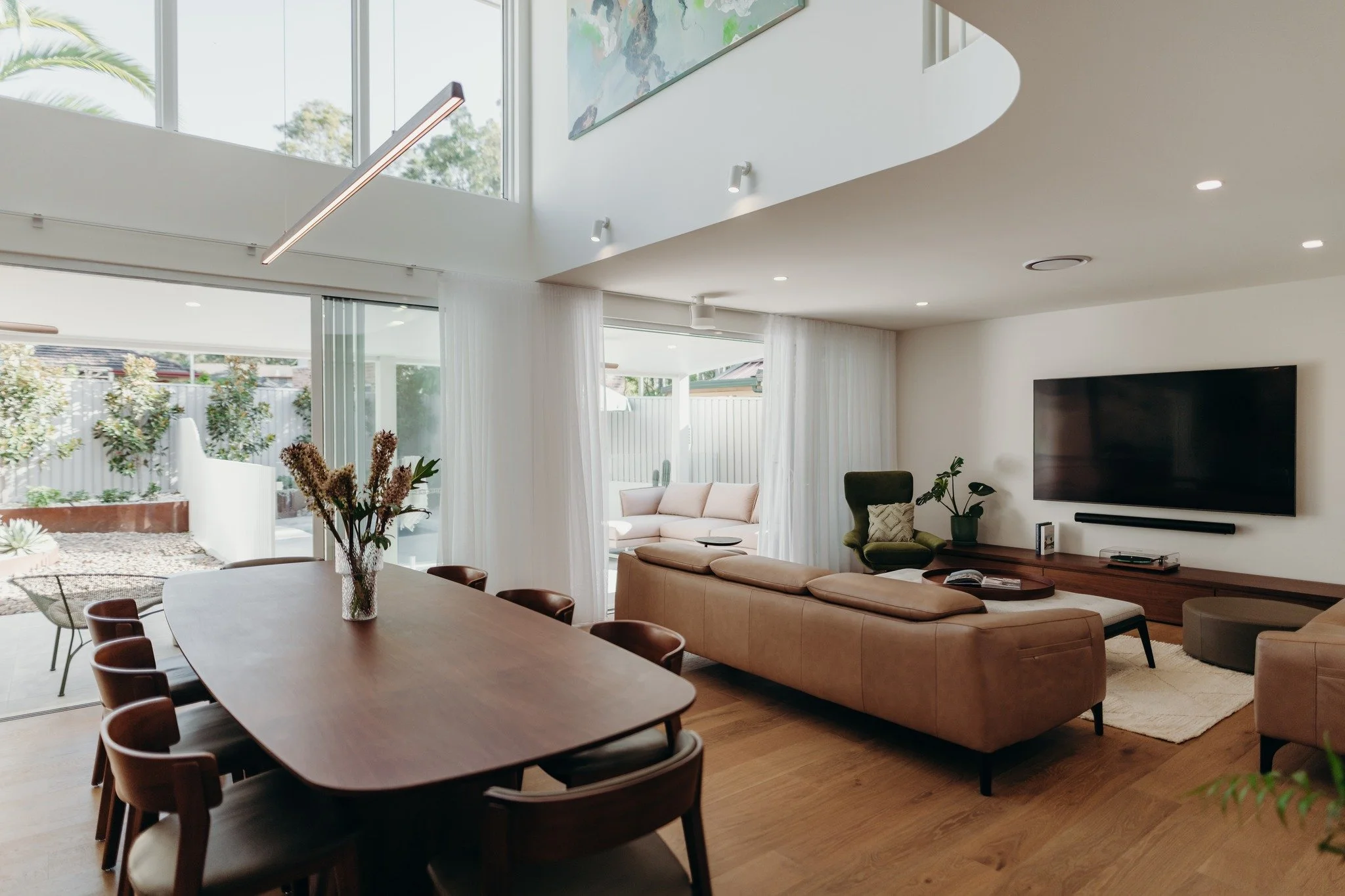 Doors wide enough that the garden becomes part of the living room. 🌿

Good design doesn't stop at the threshold. The best homes we design blur the line between inside and out &mdash; because that's where families actually spend their time together, 
