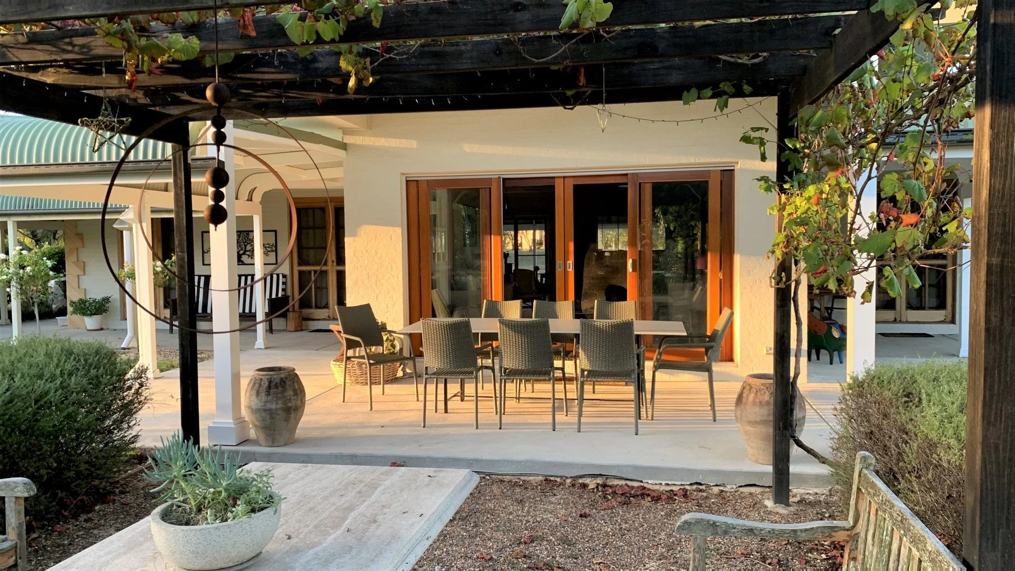 Details are what make a house feel like home. 🌿

The vine-covered pergola that filters the light just right. Doors thrown open so a breeze can move through. A table long enough for whoever drops in.  String lights for chats long into the evening. No