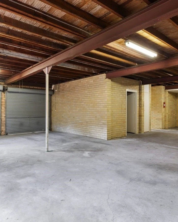 They didn't just get a renovation. They got a home with room to breathe. 

Before: a garage, with no light, no access to the yard, cold and damp. 

After: sheers pulled back, doors folded open, filled with light and warmth. One continuous space from 