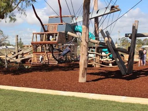 Children playing on the ship-themed playground at Dobbyn Park in Jurien Bay.