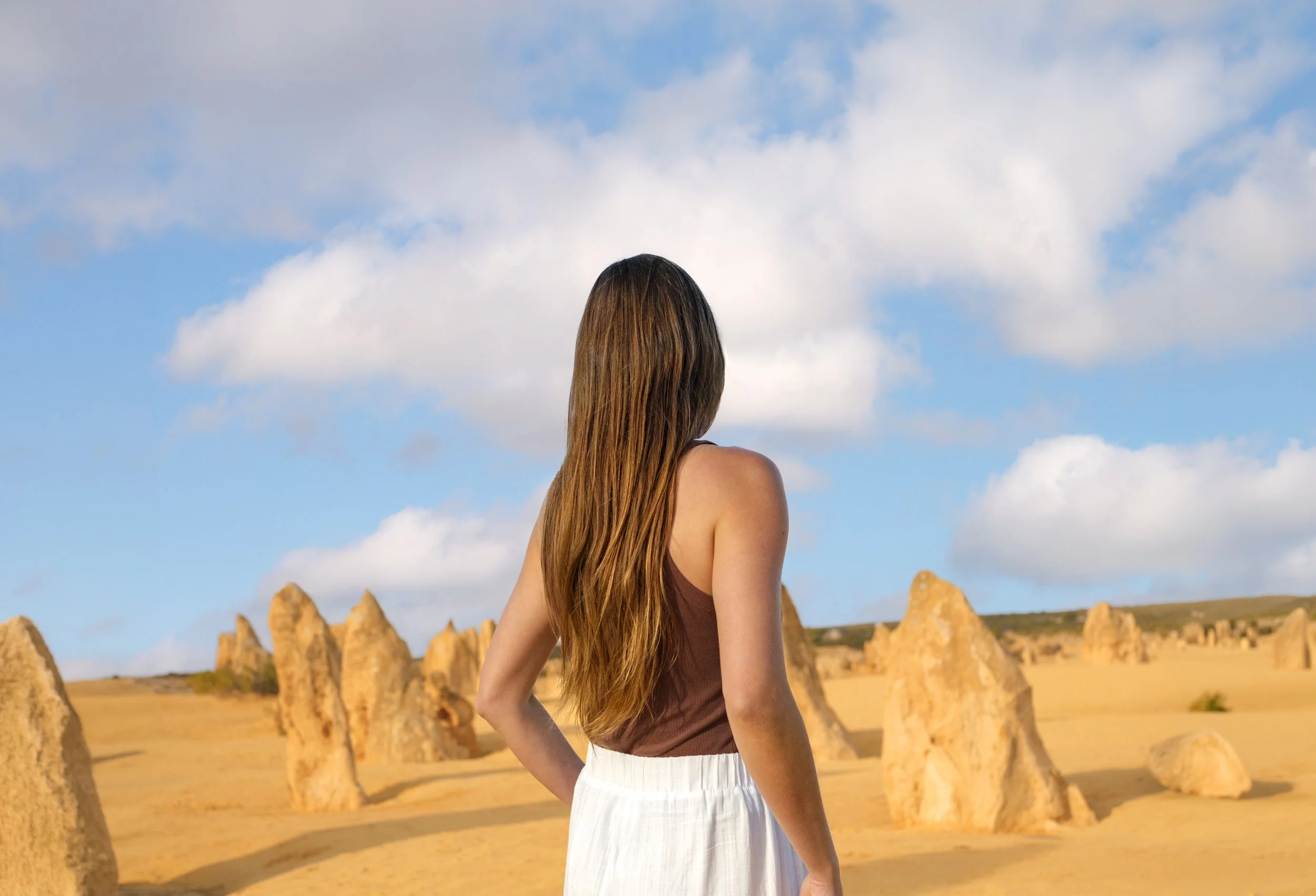 Visitor exploring the Pinnacles Desert in Nambung National Park near Jurien Bay.