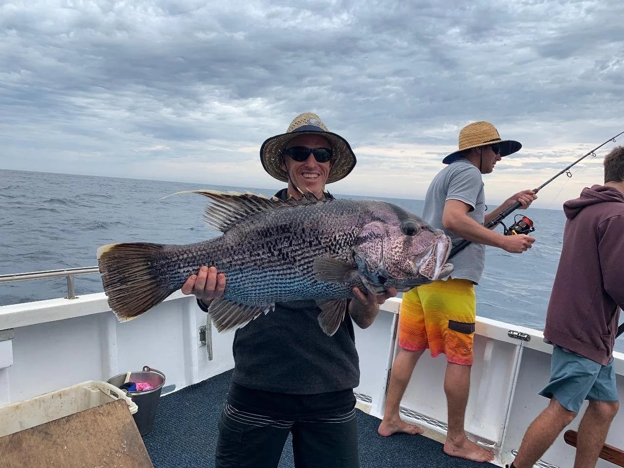 Recreational angler holding a Western Australian Dhufish caught in the waters off Jurien Bay.