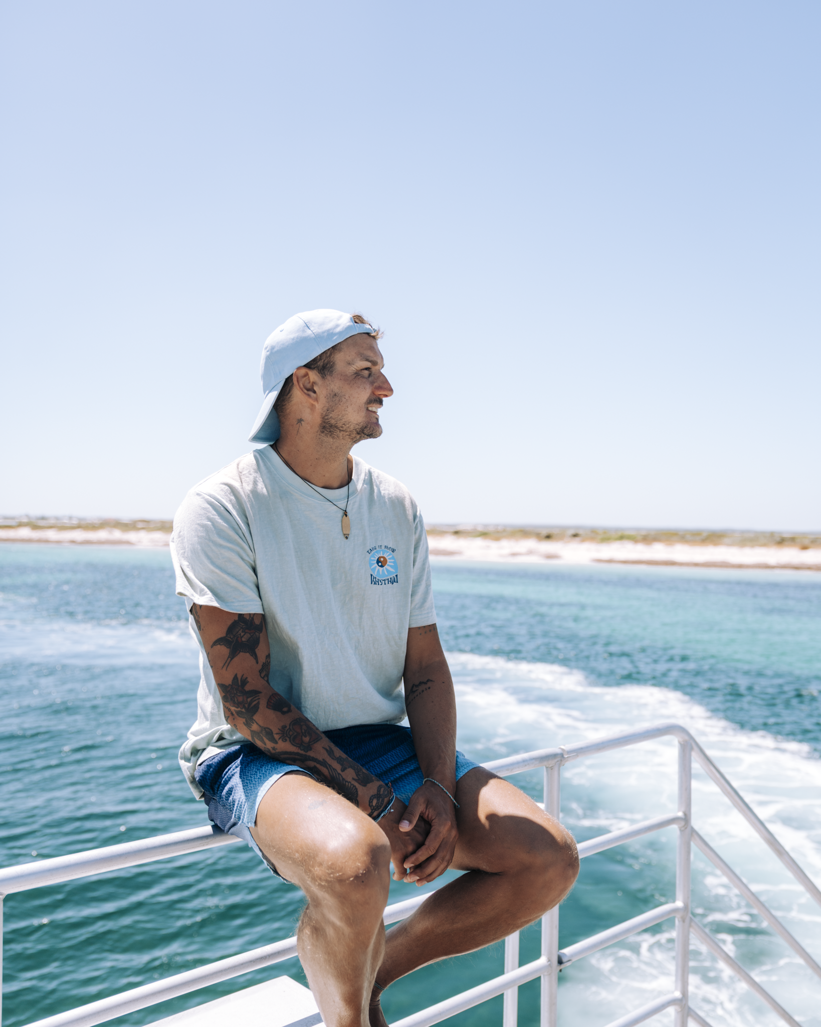 Man seated on a boat during an ocean trip through the Jurien Bay Marine Park.