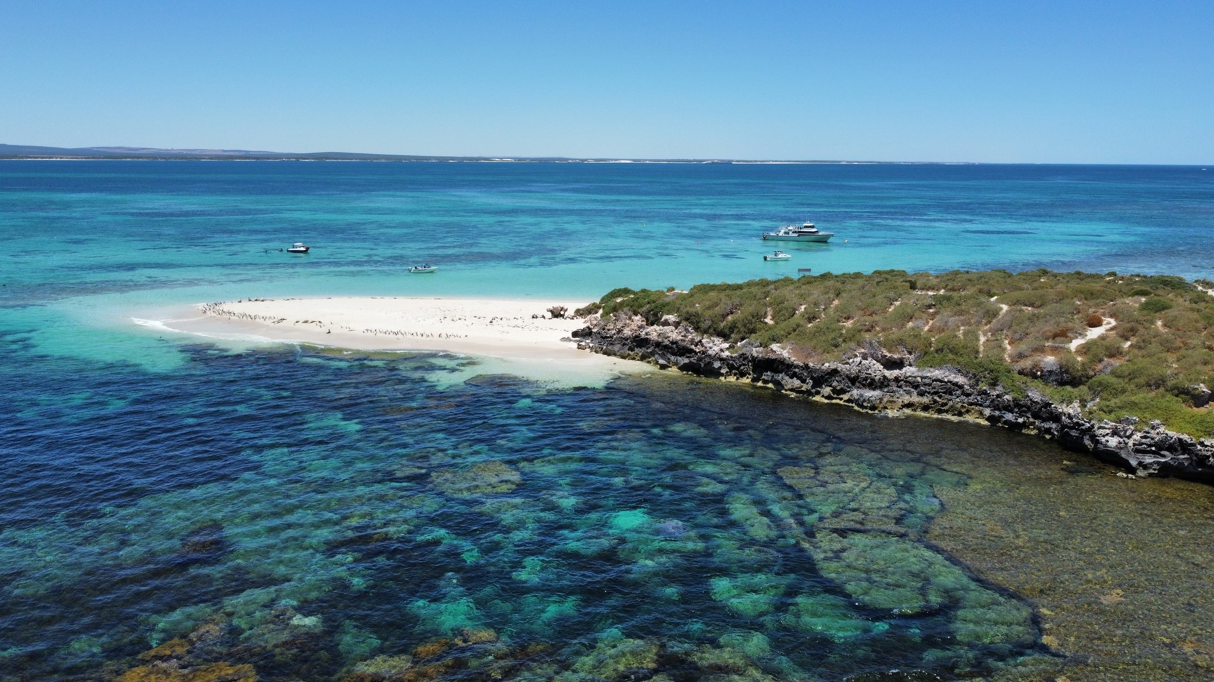 Aerial view of Jurien Bay Marine park showing turquoise reefs and coastal islands in Western Australia