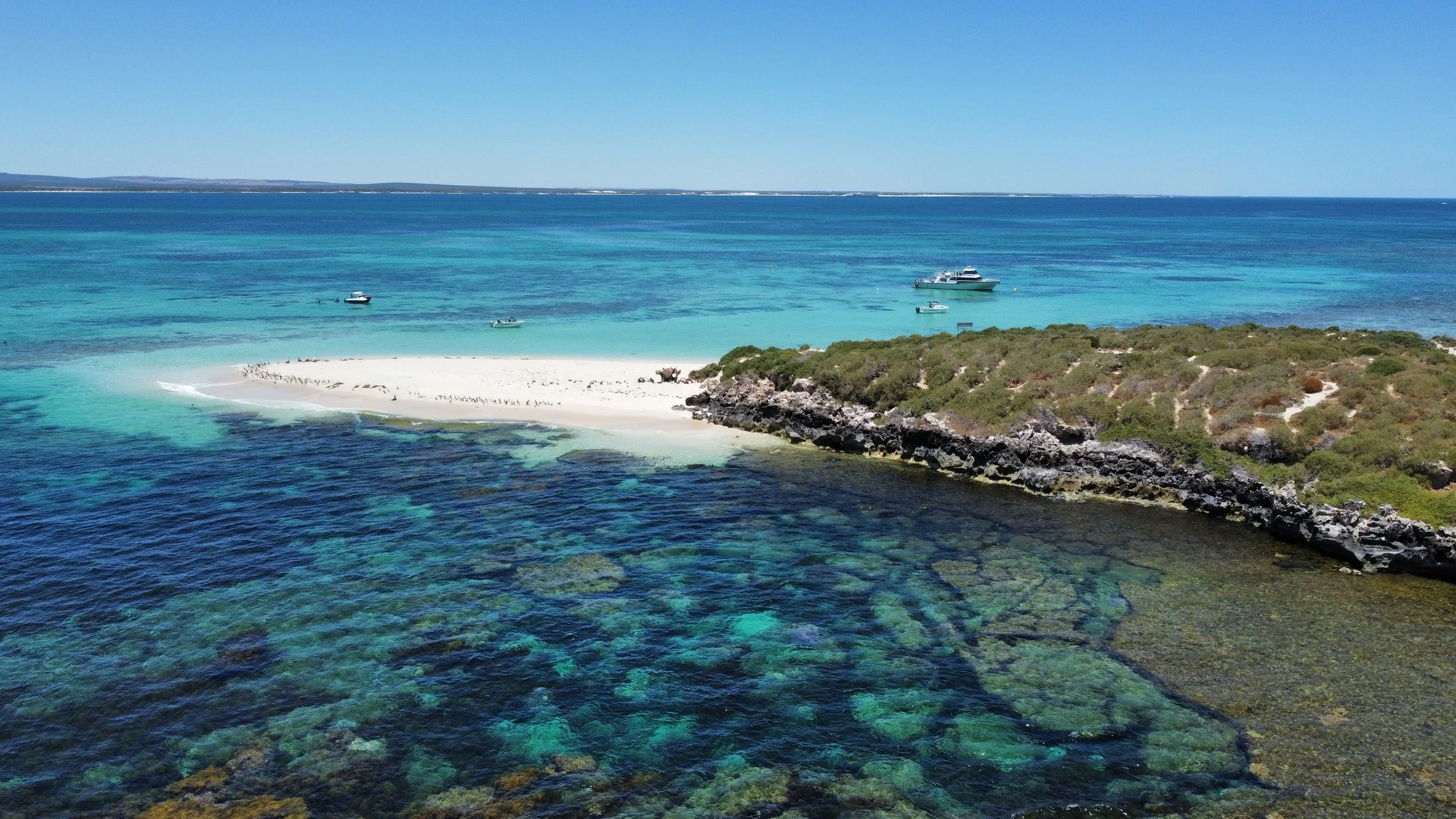Aerial view of limestone reefs and turquoise waters in the Jurien Bay Marine Park, Western Australia.