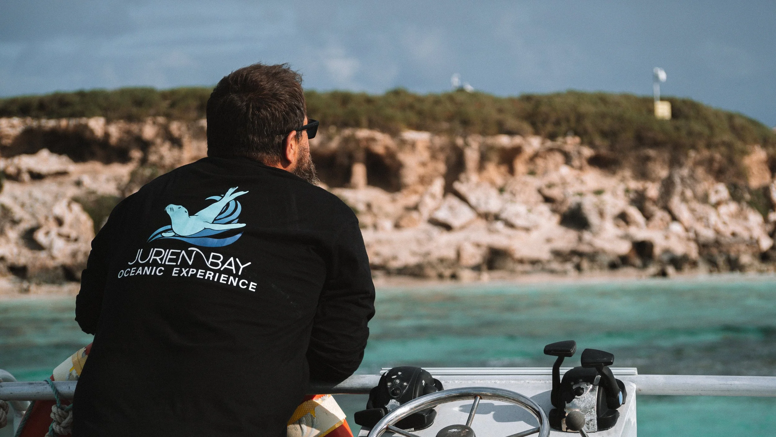Jurien Bay Oceanic Experience master observing marine habitats within the Jurien Bay Marine Park, Western Australia.