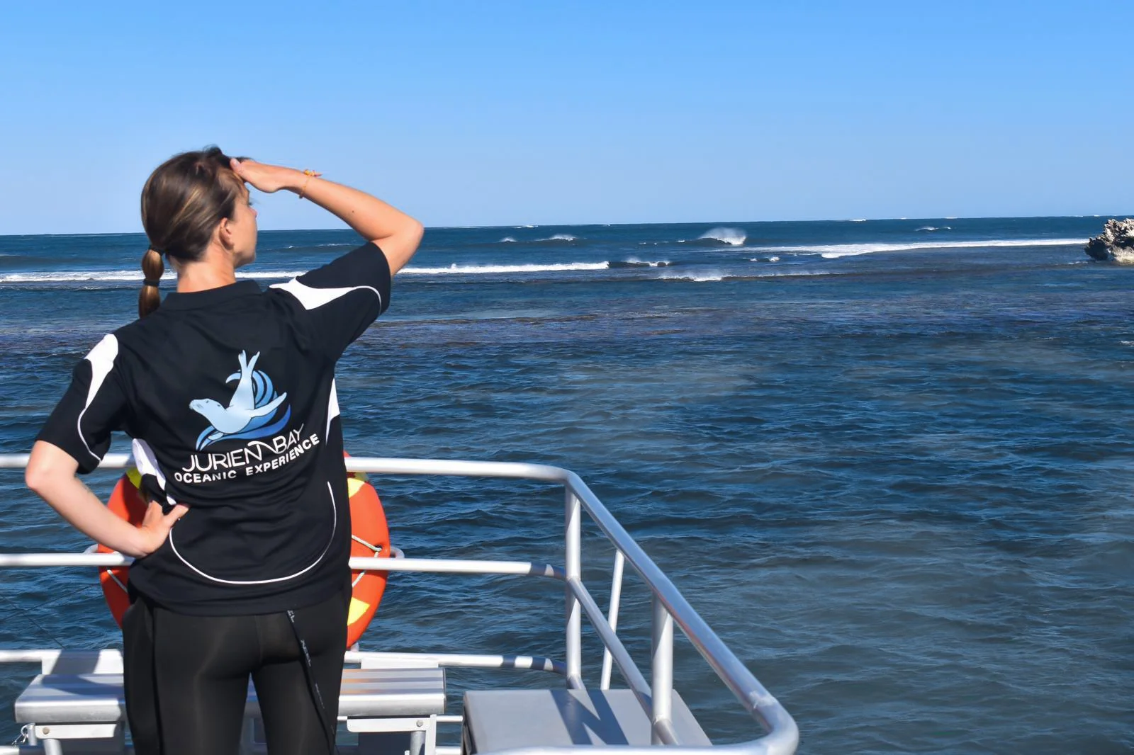 Jurien Bay Oceanic Experience guide surveying the waters of the Jurien Bay Marine Park.