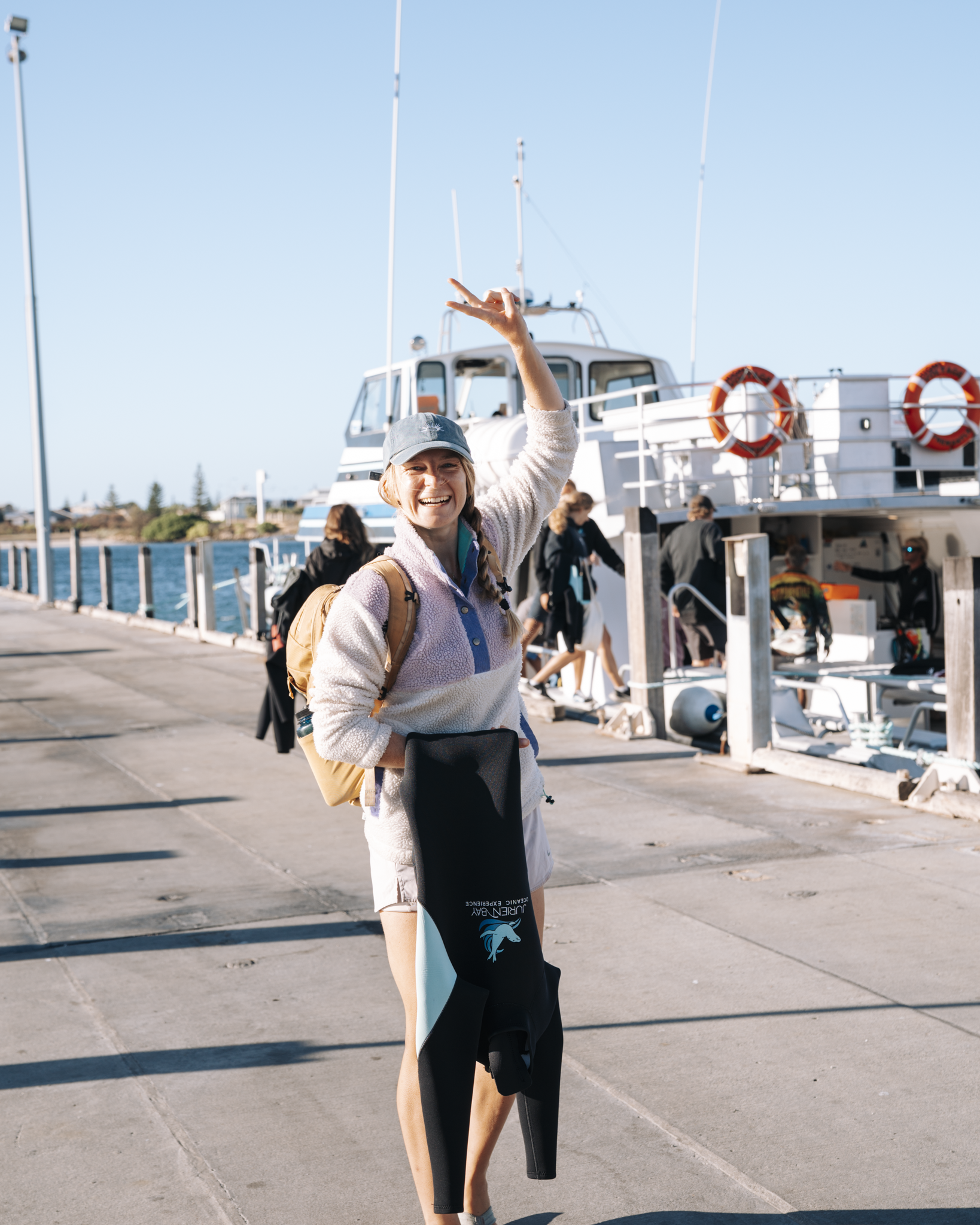 Visitor boarding a tour vessel at Jurien Bay Marine before a wildlife experience.