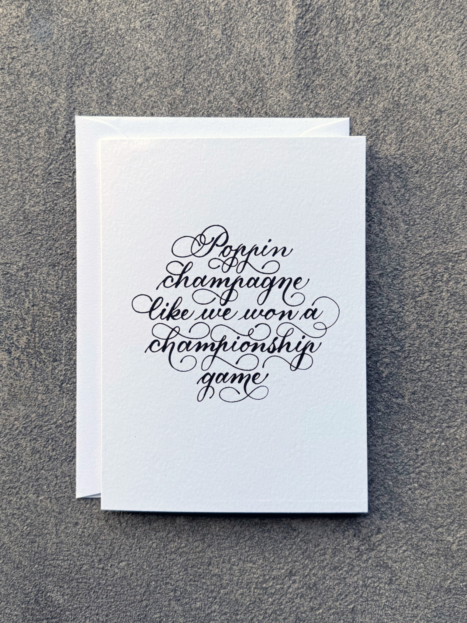 Poppin Champagne Card (white w/ black ink)