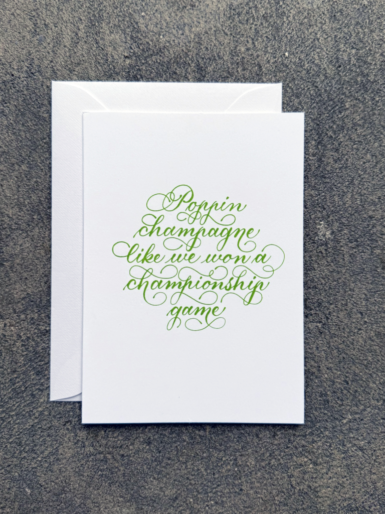 Poppin Champagne Card (white w/green ink)