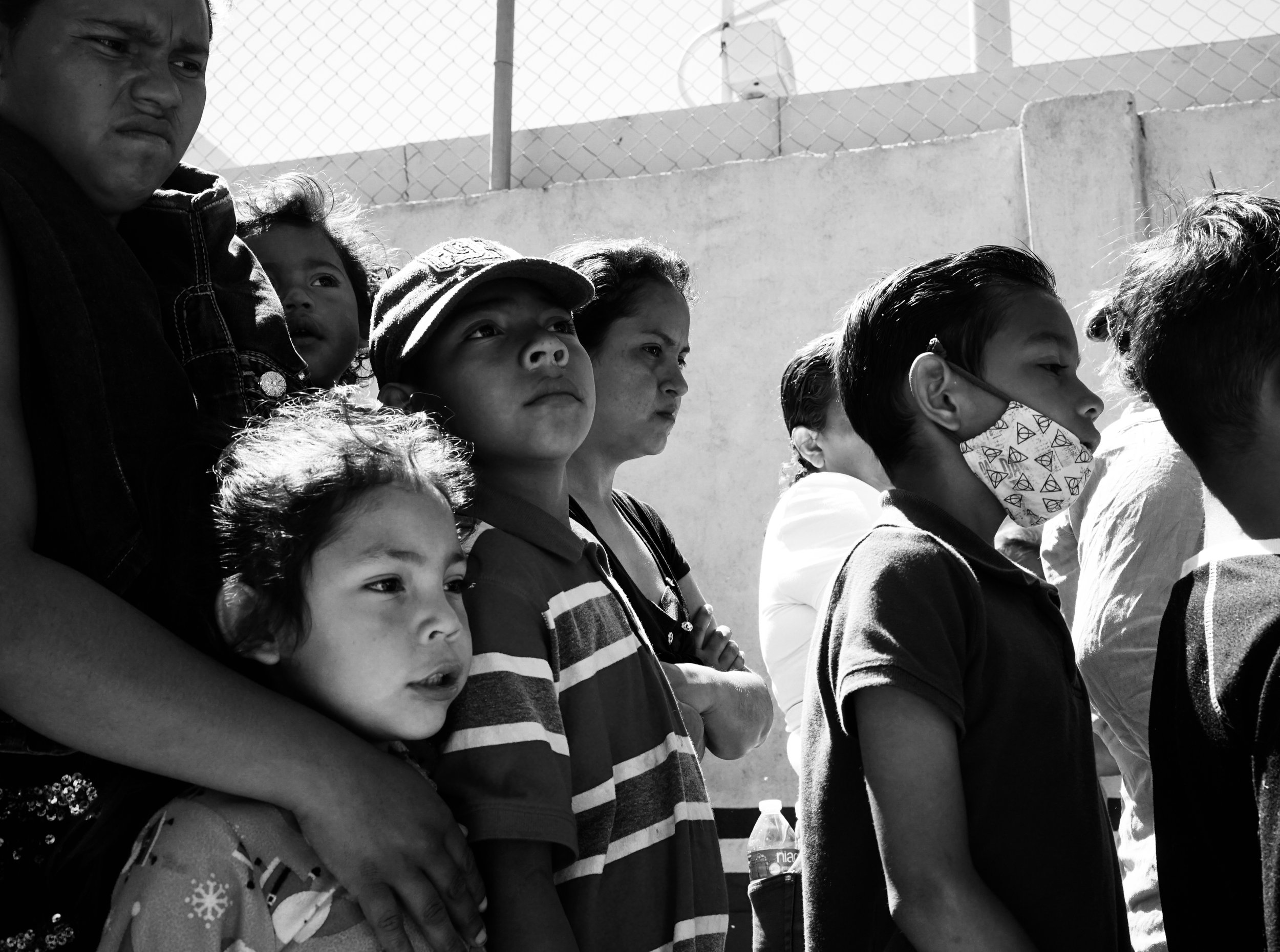  Children wait in line for food at El Chaparral in Tijuana, Mexico. 