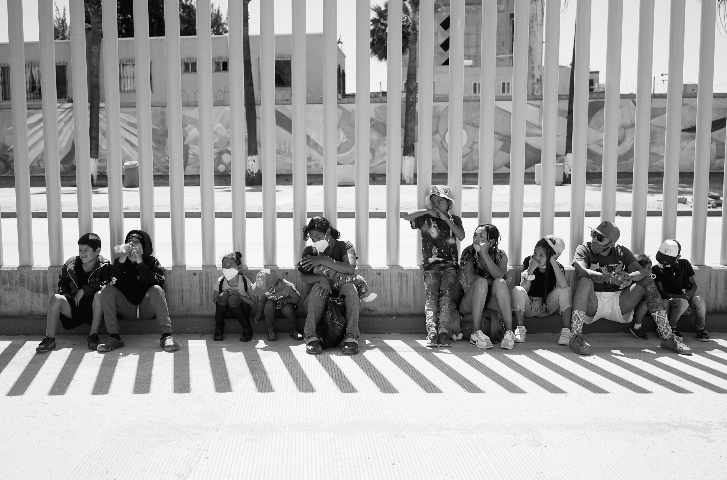  Women and children sit at the San Ysidro point of entry at the U.S.-Mexico border. 