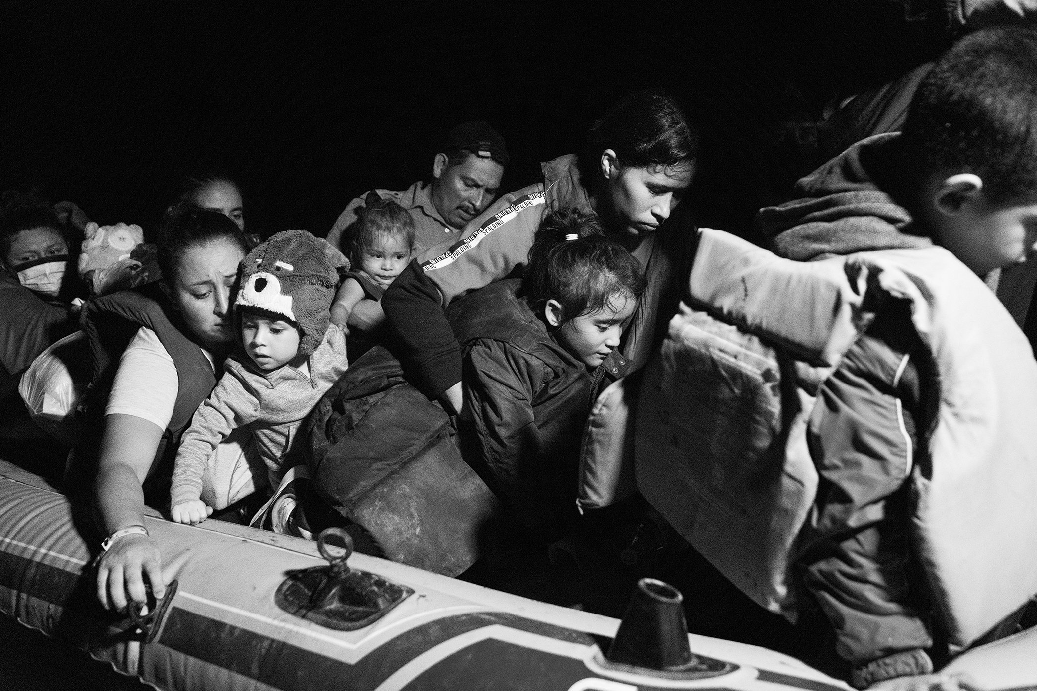  A raft carrying families seeking asylum in the United States arrives in Roma, Texas. 