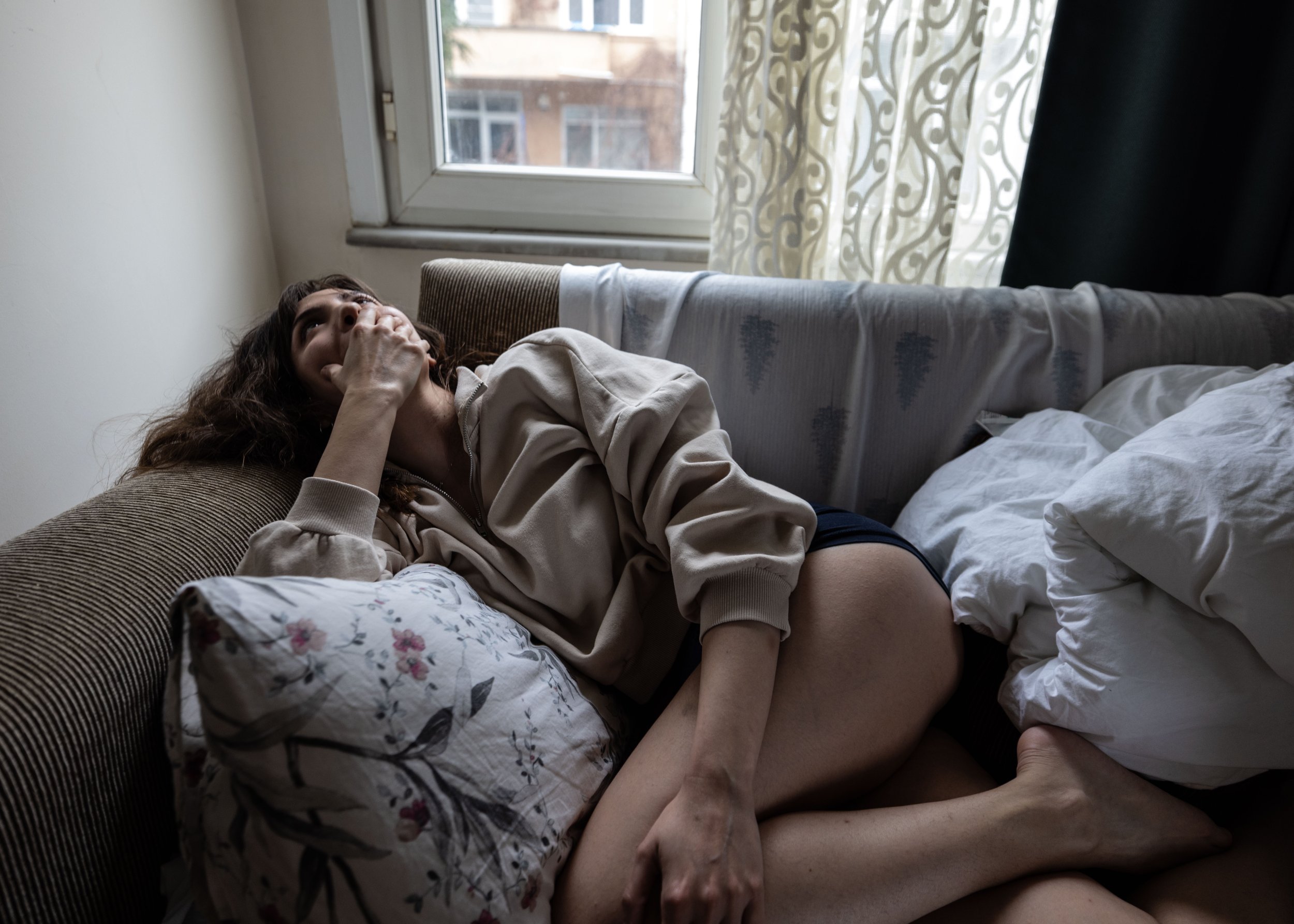  Isik, 27, leans back on the couch in her apartment as she describes the culture around women in Turkey disclosing her own experiences with sexual violence. 