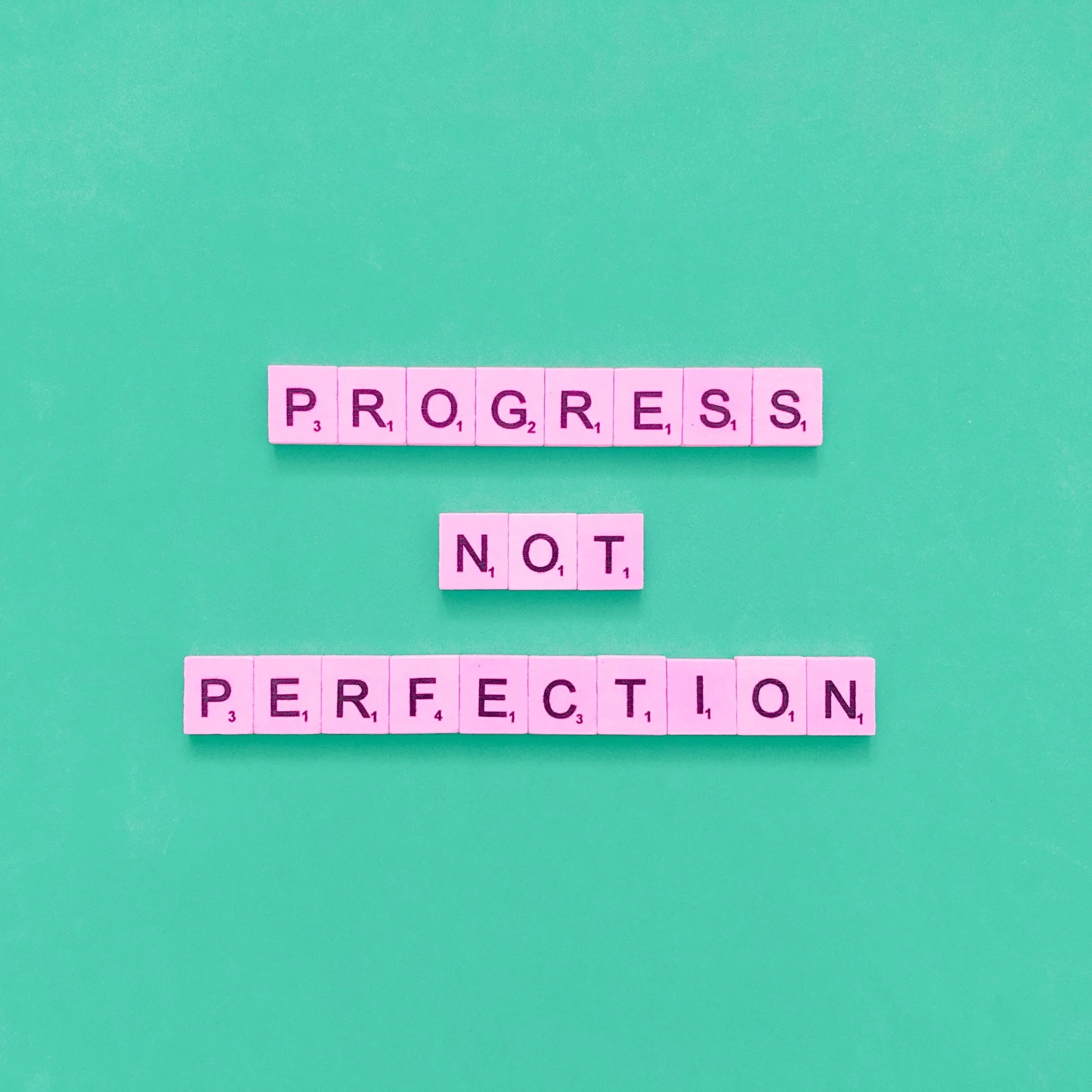 How can organisations overcome perfectionism paralysis?