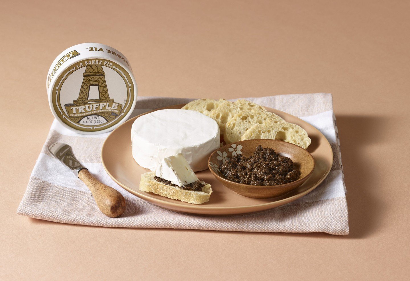 Truffle season is here, and our Truffle Brie is ready for it!

Creamy, buttery, and laced with decadent black truffle, it brings a rich, earthy aroma to every bite. Spread it, melt it, or pair it, this Brie makes any cozy moment feel a little more in