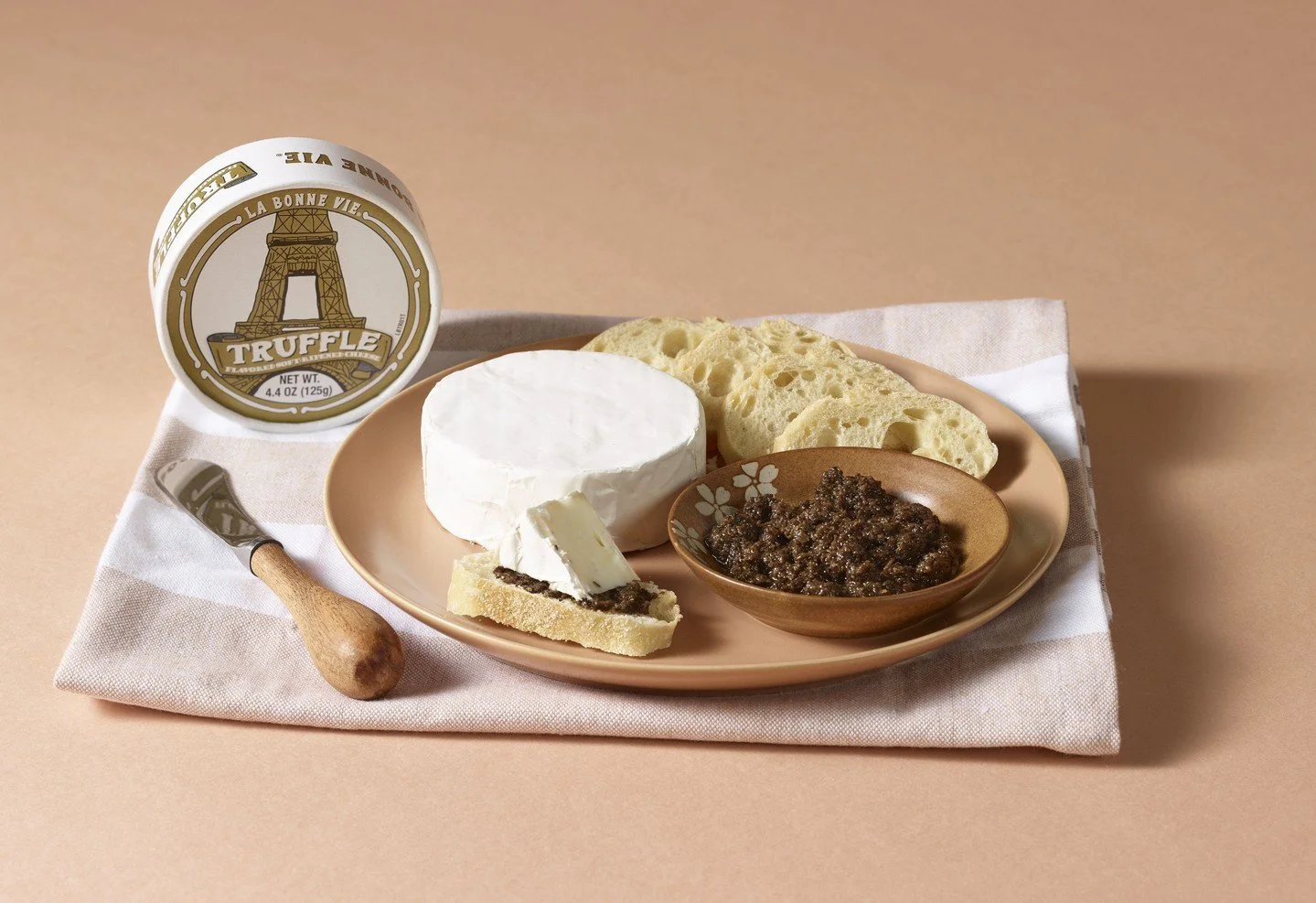 Truffle season is here, and our Truffle Brie is ready for it!

Creamy, buttery, and laced with decadent black truffle, it brings a rich, earthy aroma to every bite. Spread it, melt it, or pair it, this Brie makes any cozy moment feel a little more in