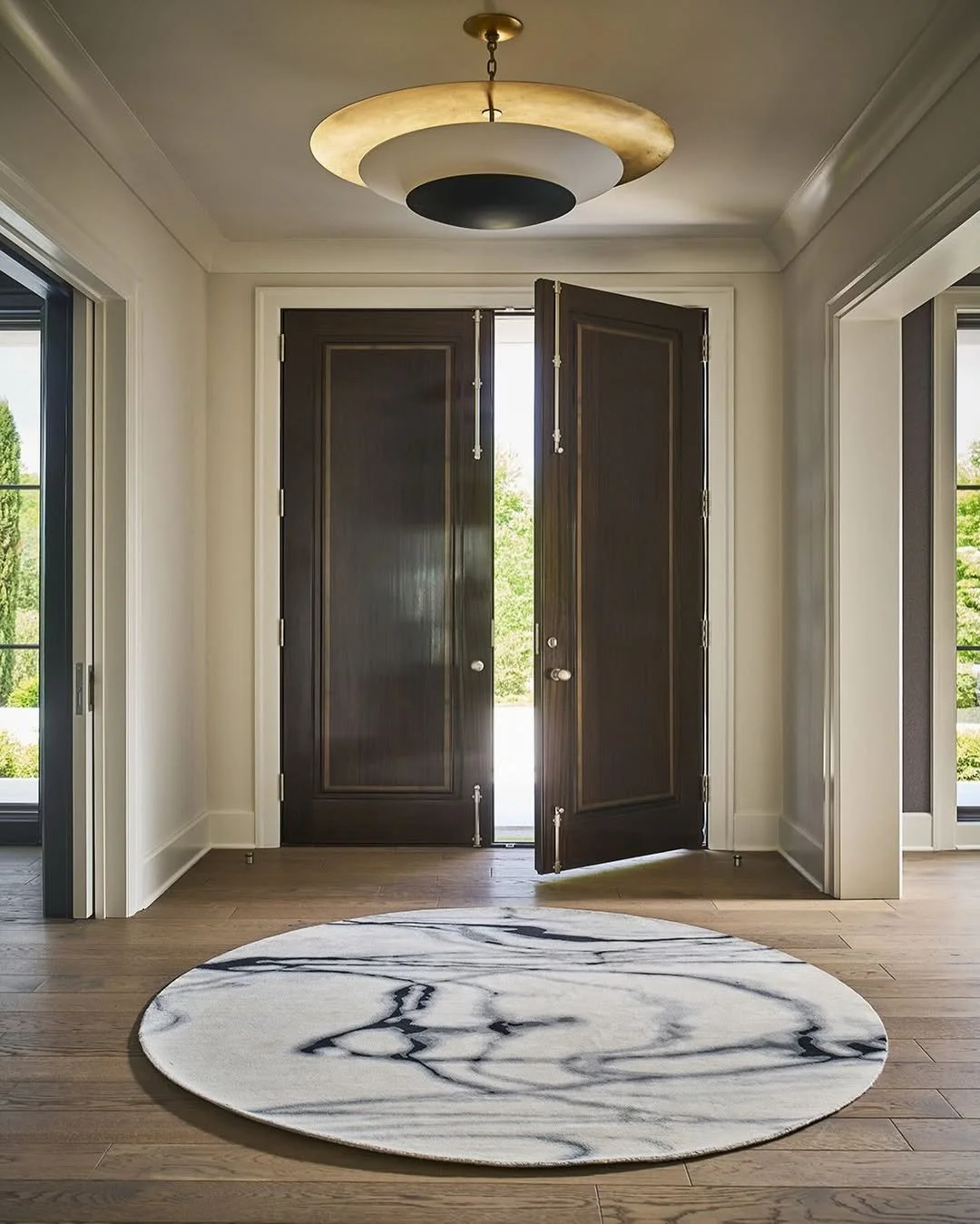 A first impression, softened.

The wool and silk Waterlines rug from @taniajohnsondesign brings quiet movement to the entryway &mdash; a subtle interplay of sheen and texture that shifts with the light.

Fluid pattern.
Refined hand.

An invitation in