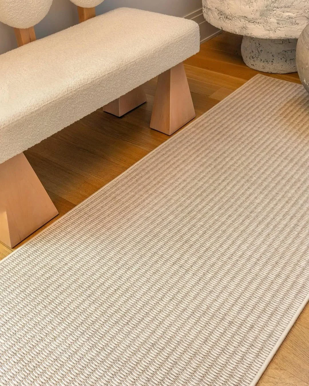 A meeting of texture, tone, and natural materiality.

ZANZIBAR in Sandstone from @scanderrugs weaves together New Zealand wool and natural wood fiber in a composition that feels both grounded and quietly expressive. The surface carries a soft, organi