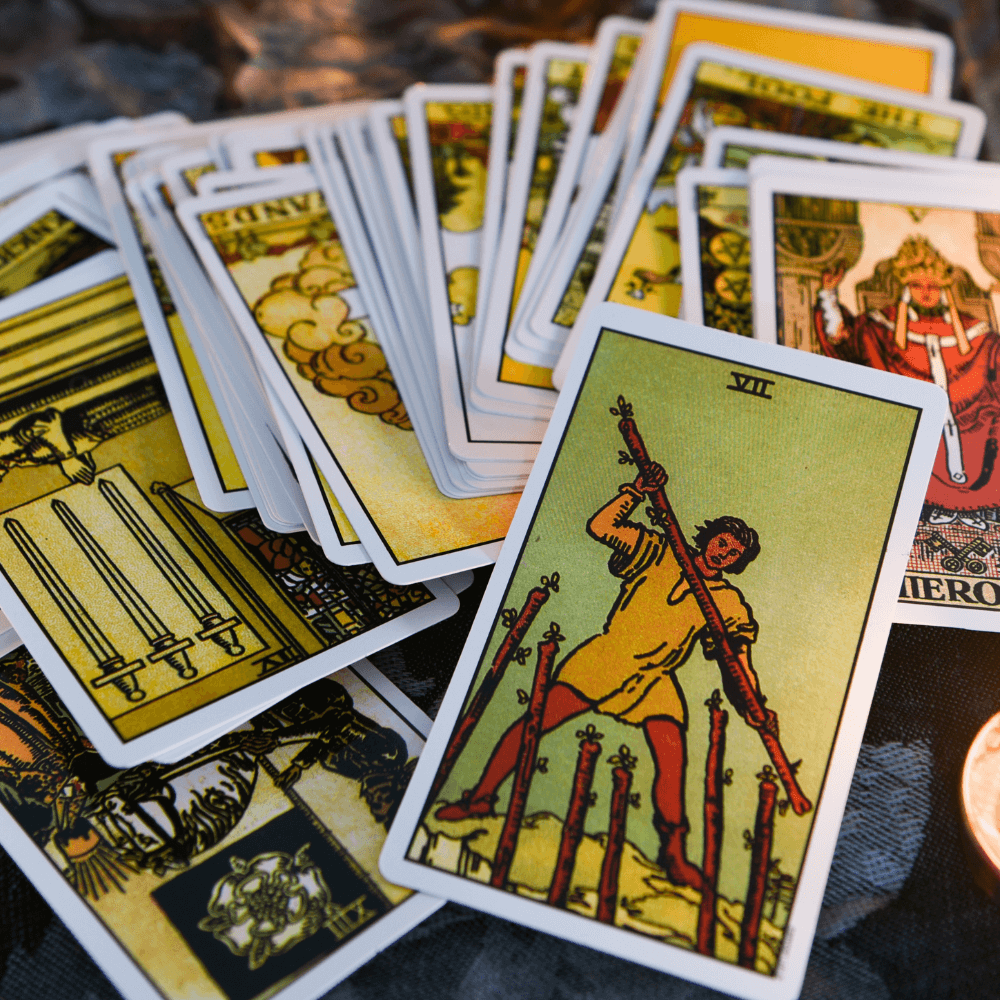 IMAGE OF RIDER WAITE SMITH TAROT CARDS SPREAD OUT ON TABLE