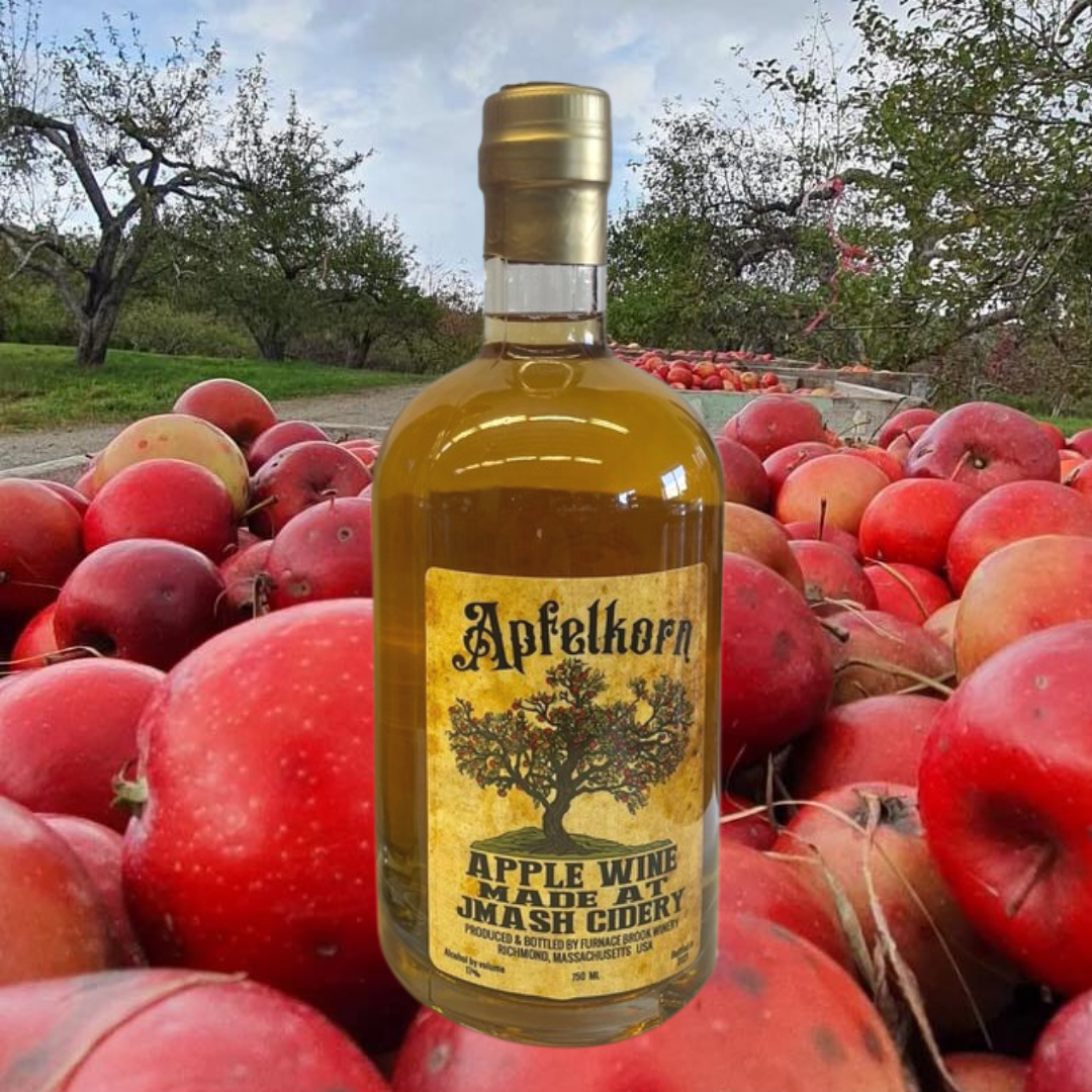 HIlltop Orchards Apfelkorn Apple Wine with an Apple Cart in the Background
