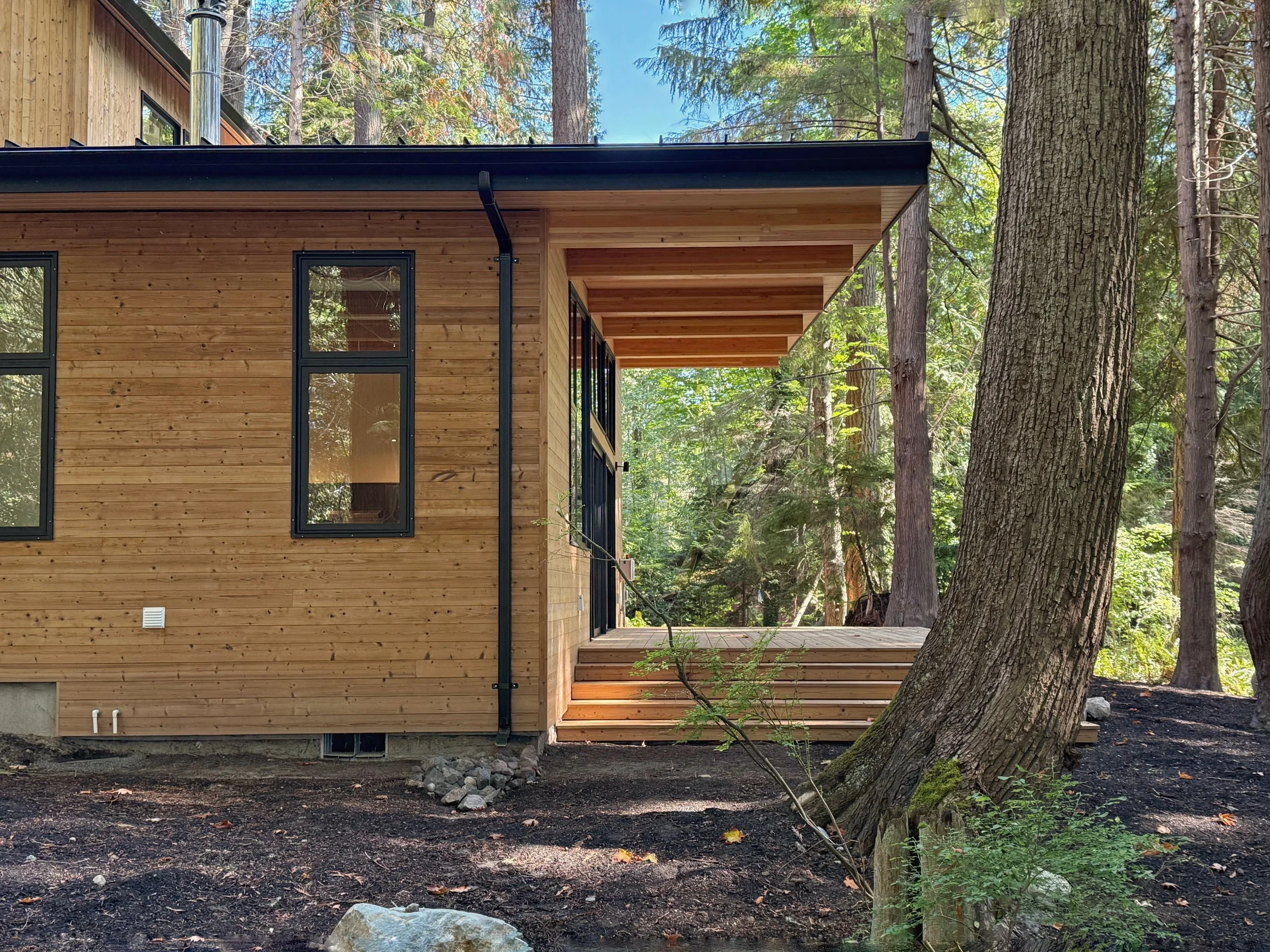 spotswood-architecture-design-indianola-custom-home-indianloa-washington-exterior-side.jpeg