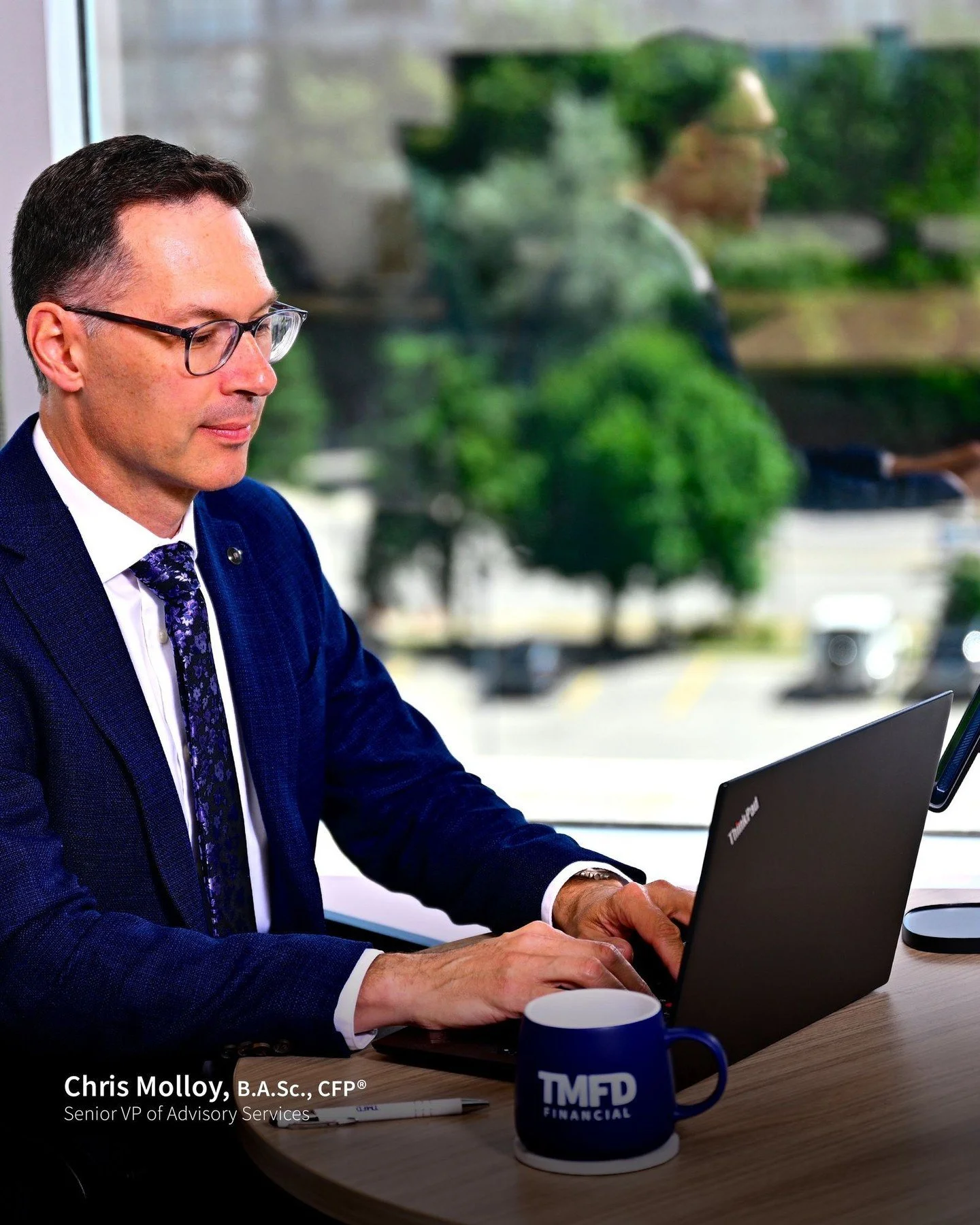 A quiet moment in our Mississauga office: Chris Molloy, B.A.Sc., CFP&reg;, Senior VP of Advisory Services, reviewing a dentist&rsquo;s financial plan.

The TMFD mug by his side ☕, reflection in the window, and over 25 years of experience behind every