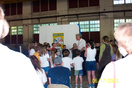 Edgar May presenting to children within the historic Foundry Building