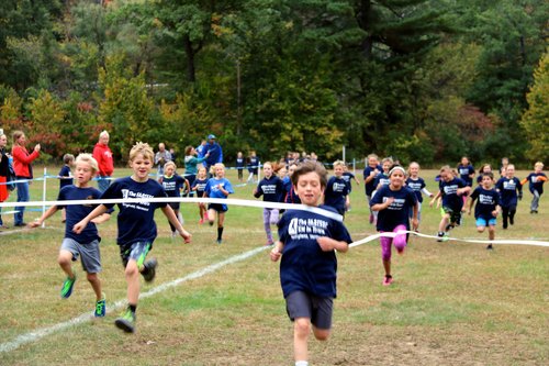 Children racing across the finish line