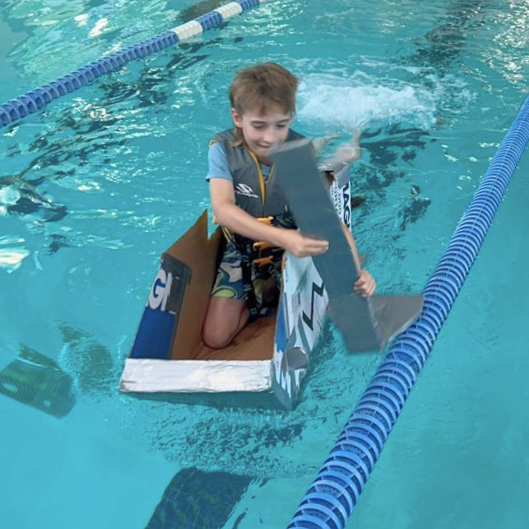 Cardboard yacht races across the pool