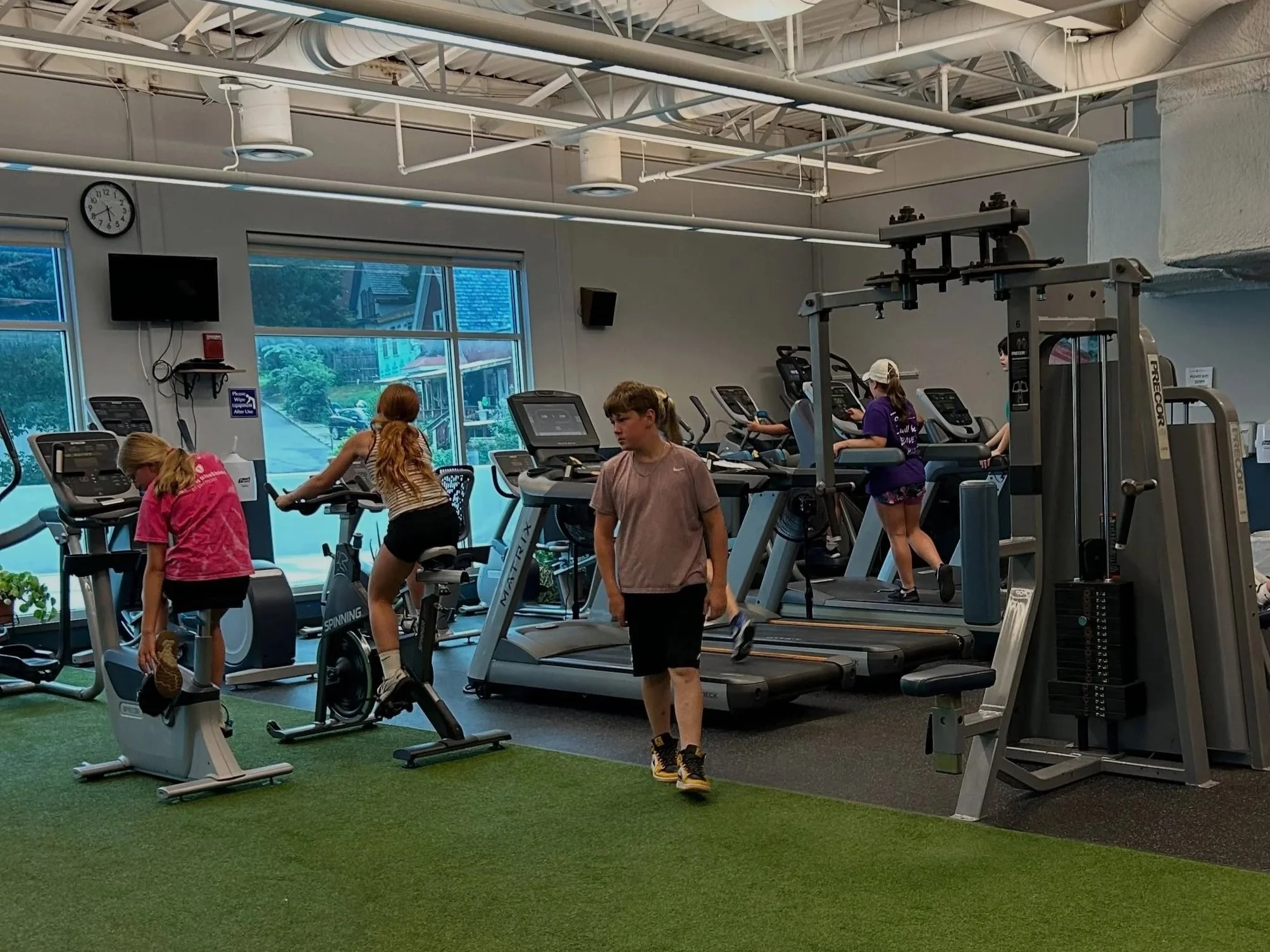 Teens using fitness equipment