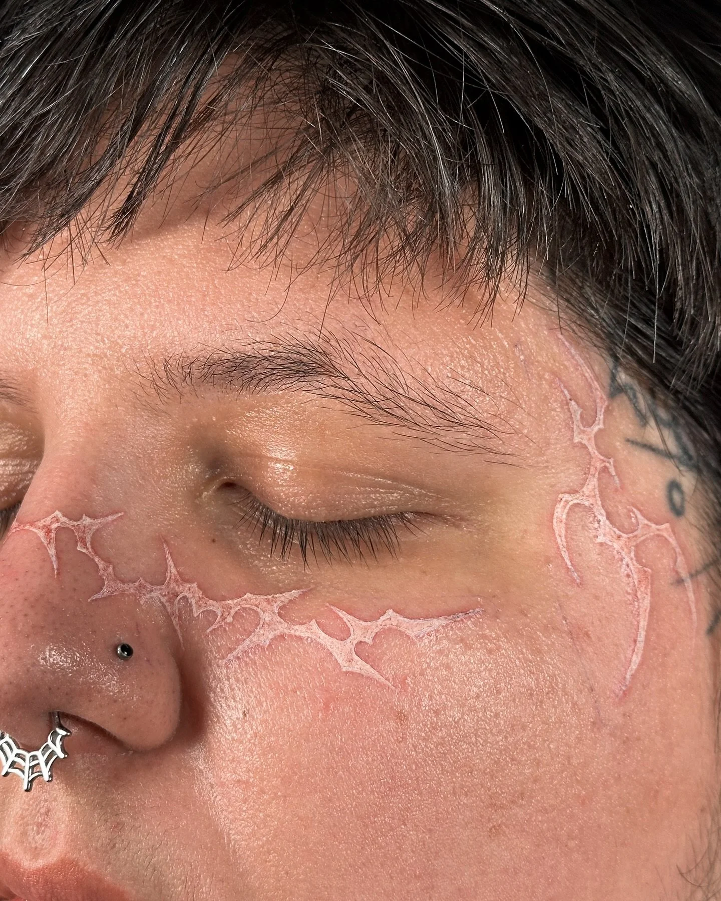 white ink face tats once again :&rsquo;) nose section not symmetric but temples are!! this was so much fun tHANK YOU SO MUCH 4EVER. Made @lacuna._.studio 
𝗕𝗢𝗢𝗞𝗜𝗡𝗚 ✧ Toronto [Nov &amp; Dec] 
&bull;
&bull;
&bull;
&bull;
&bull;
#facetattoo #white