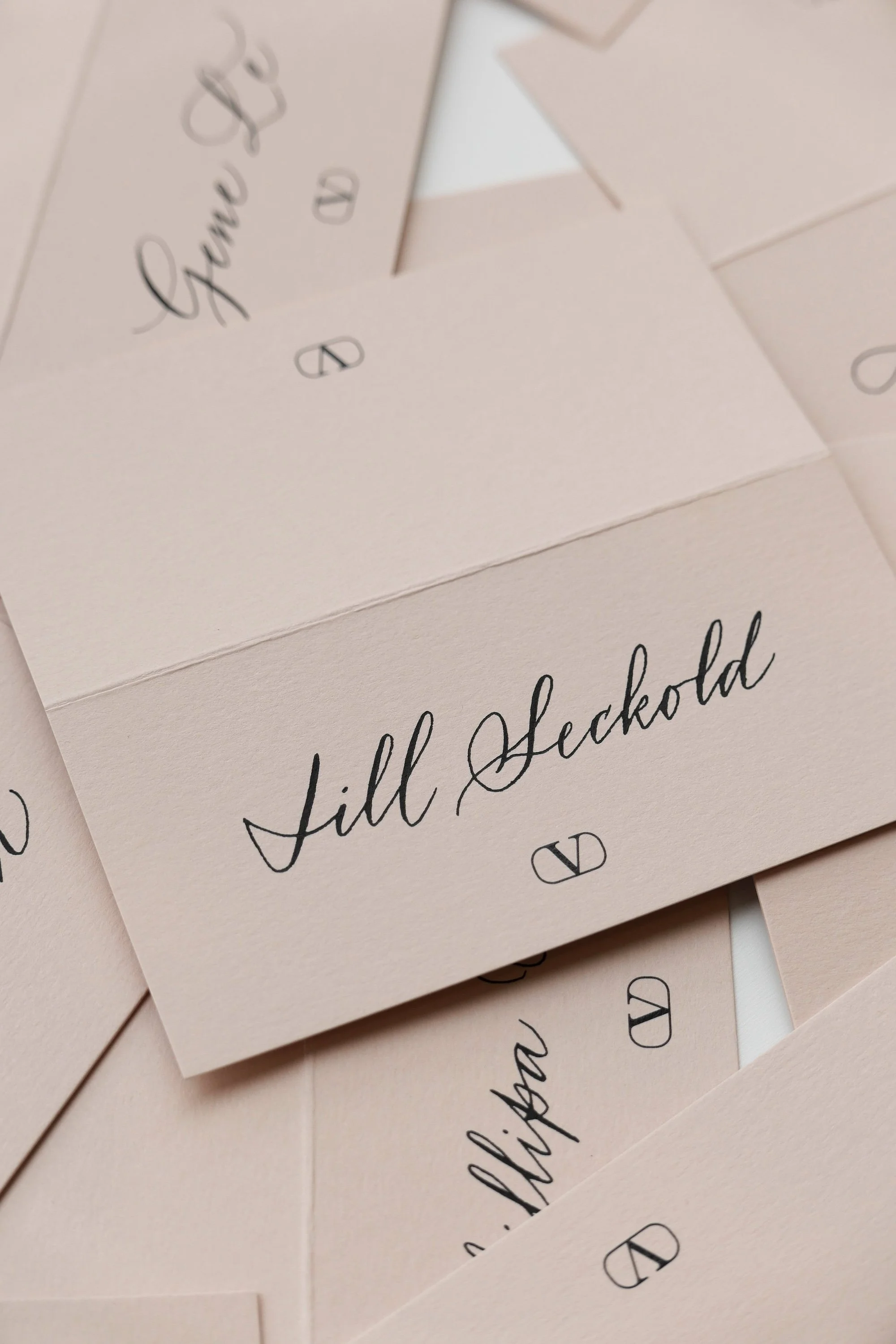 place cards for Valentino Fashion House in Lilac Calligraphy lettering style