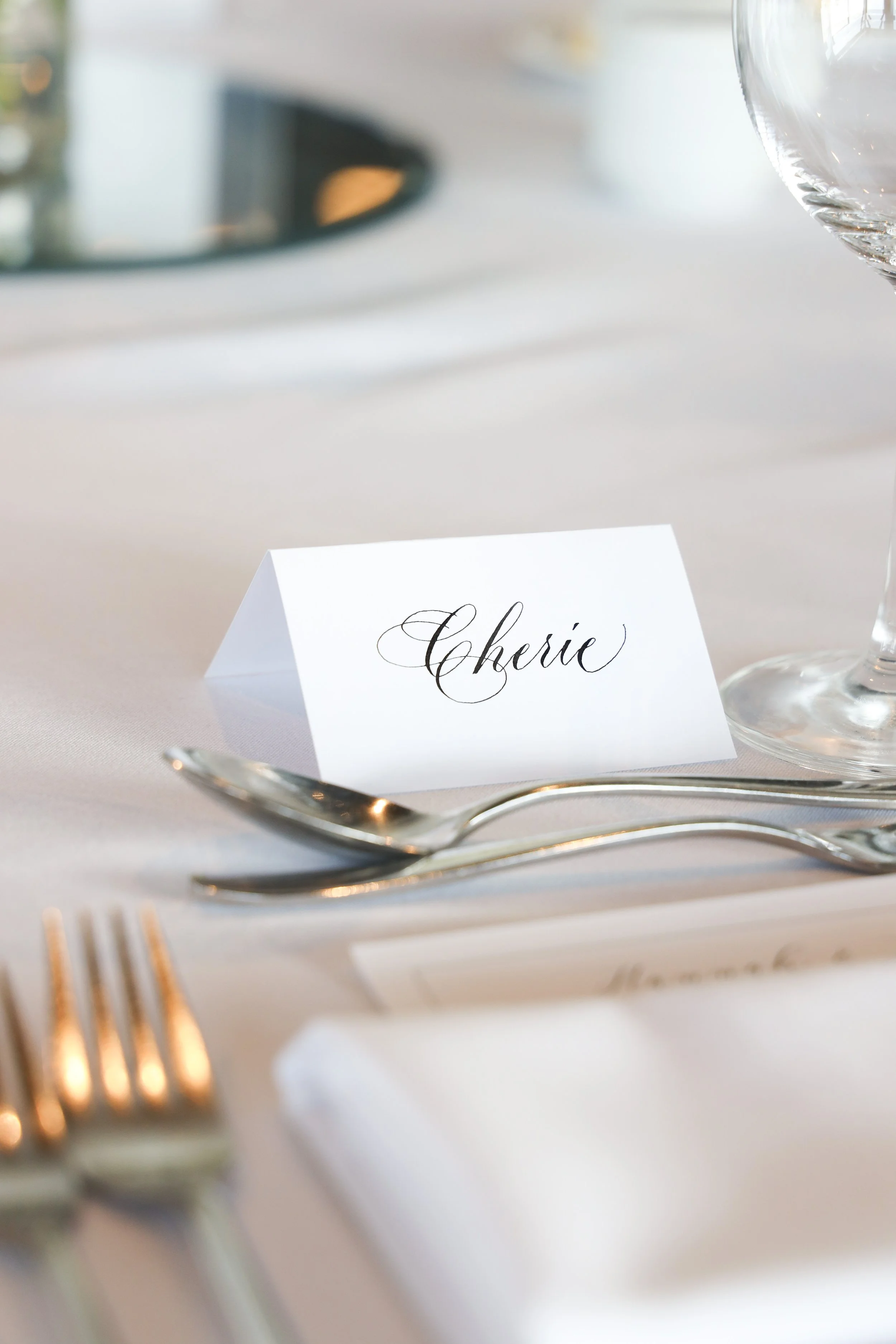 Luxurious wedding place cards with Copperplate calligraphy