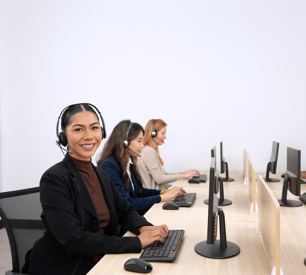 Cyber Acoustics support team wearing headsets while working at their computers